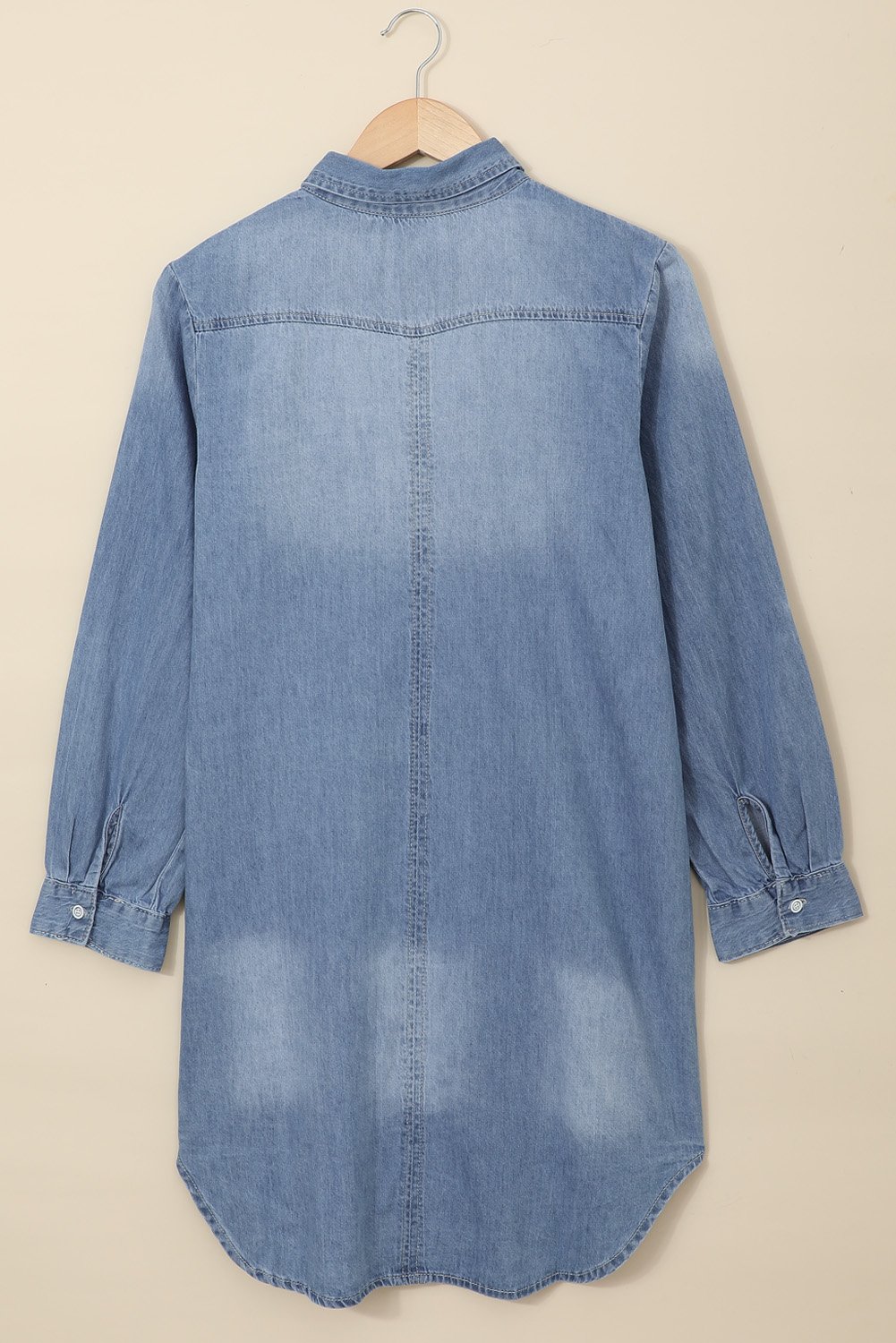 A stylish Turn Down Collar Button Down Long Sleeve Denim Shirt Mini Dress displayed on a mannequin, showcasing its classic denim fabric and button details.