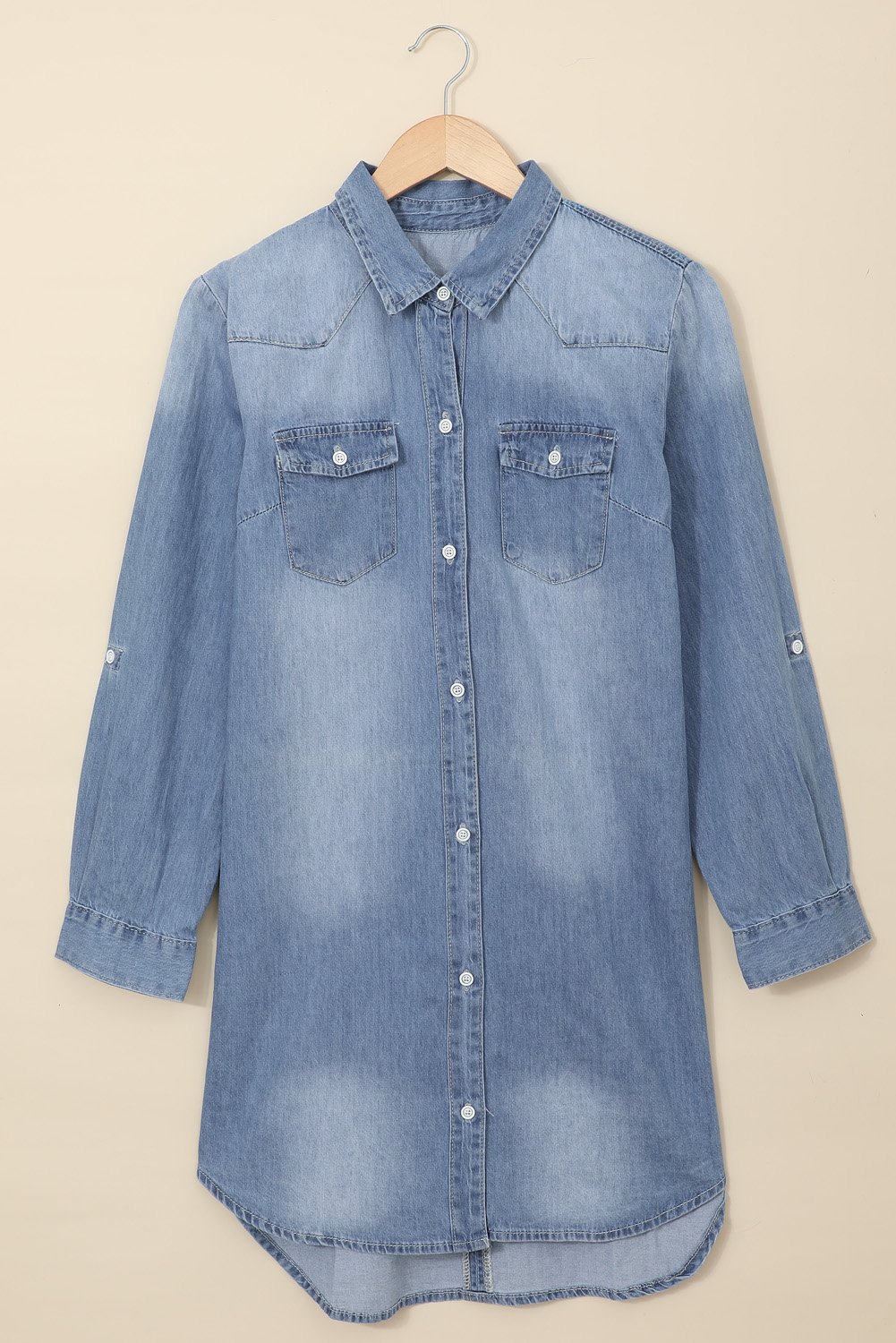 A stylish Turn Down Collar Button Down Long Sleeve Denim Shirt Mini Dress displayed on a mannequin, showcasing its classic denim fabric and button details.