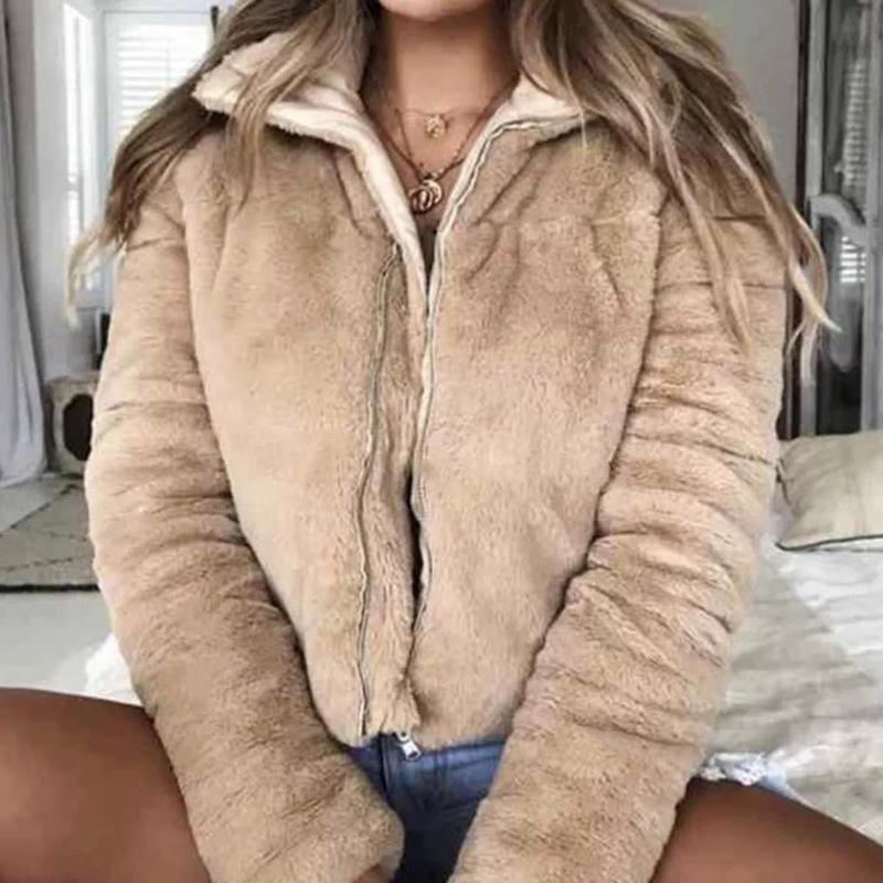 A stylish women's faux fur jacket with a turndown collar, featuring a zipper closure and long sleeves, perfect for winter streetwear.