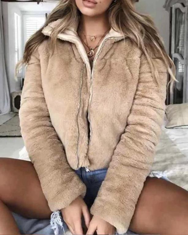 A stylish women's faux fur jacket with a turndown collar, featuring a zipper closure and long sleeves, perfect for winter streetwear.