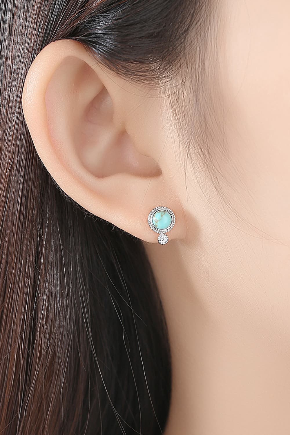 Elegant turquoise earrings with platinum plating and zircon accents, displayed in a matching gift box.