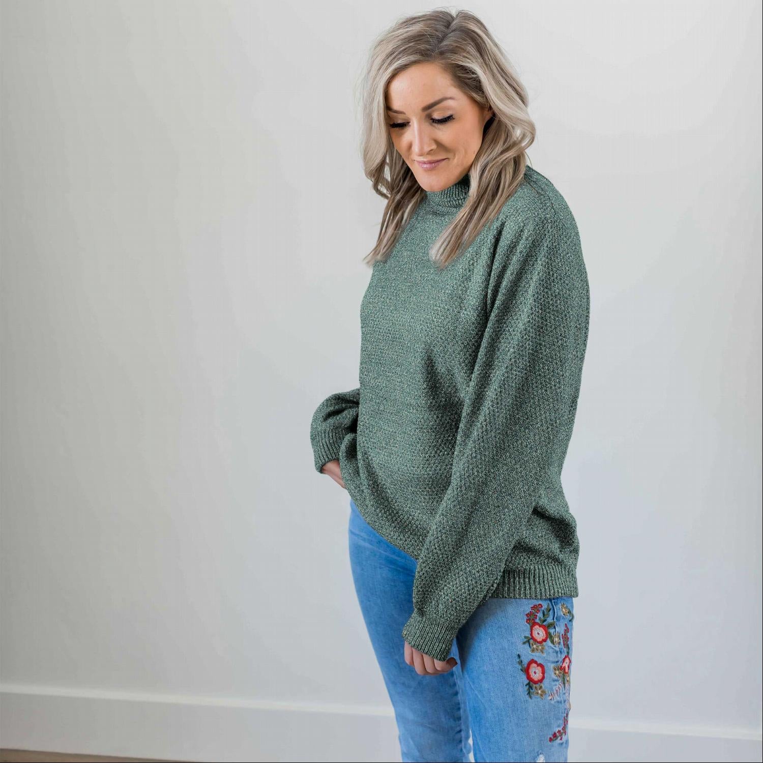 A cozy Turtleneck Melange Balloon Sleeve Sweater in a stylish oversized fit, featuring long balloon sleeves and a ribbed turtleneck.