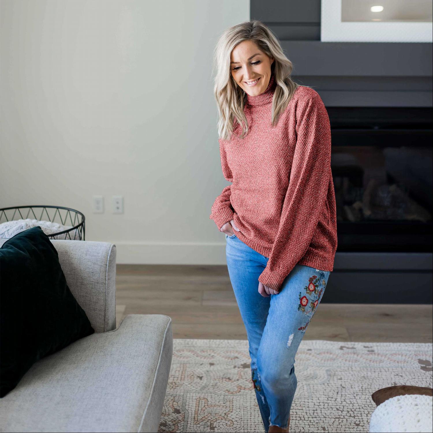 A cozy Turtleneck Melange Balloon Sleeve Sweater in a stylish oversized fit, featuring long balloon sleeves and a ribbed turtleneck.