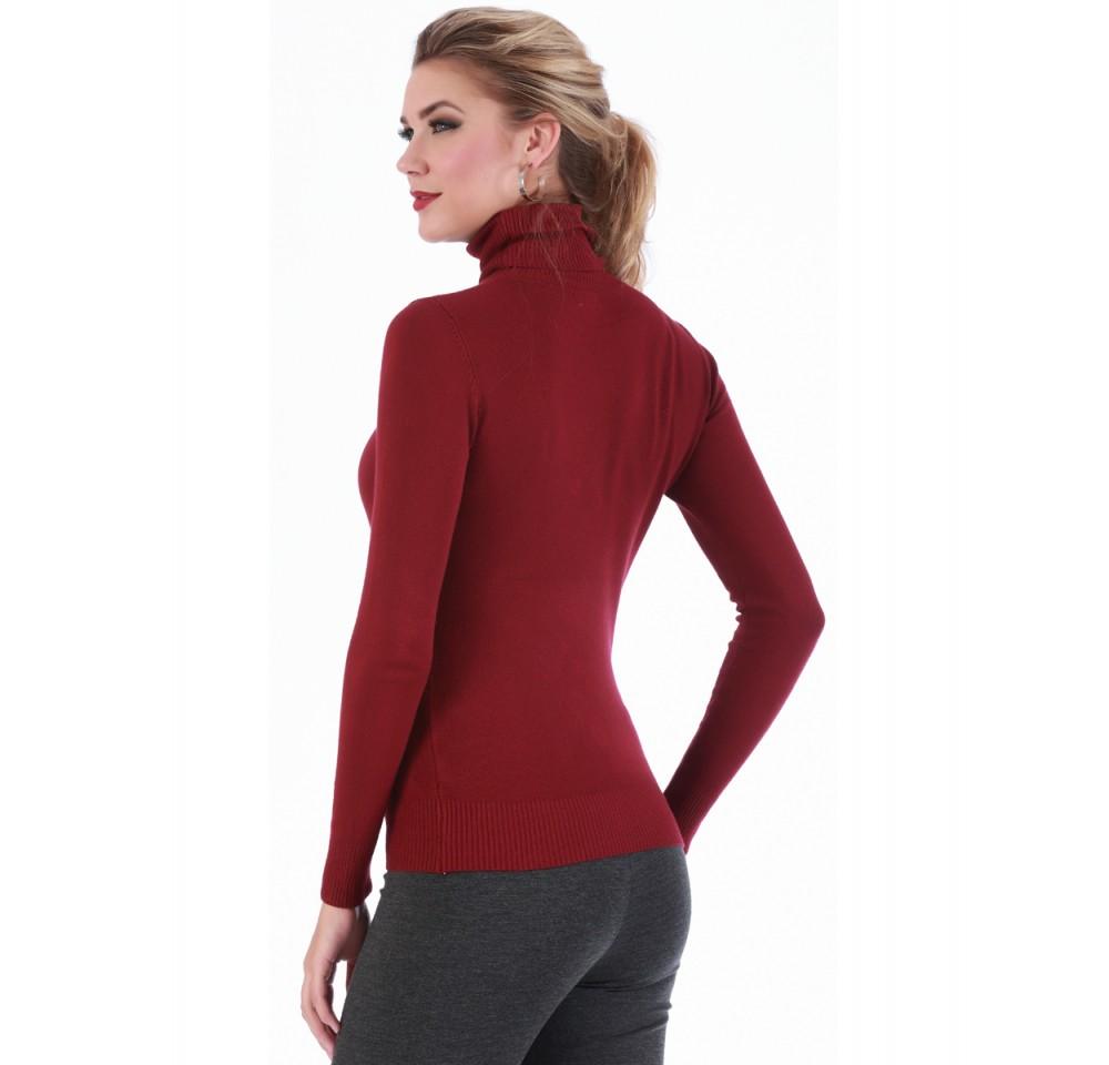 A stylish turtleneck sweater featuring ribbed cuffs and hem, perfect for layering and keeping warm during colder months.