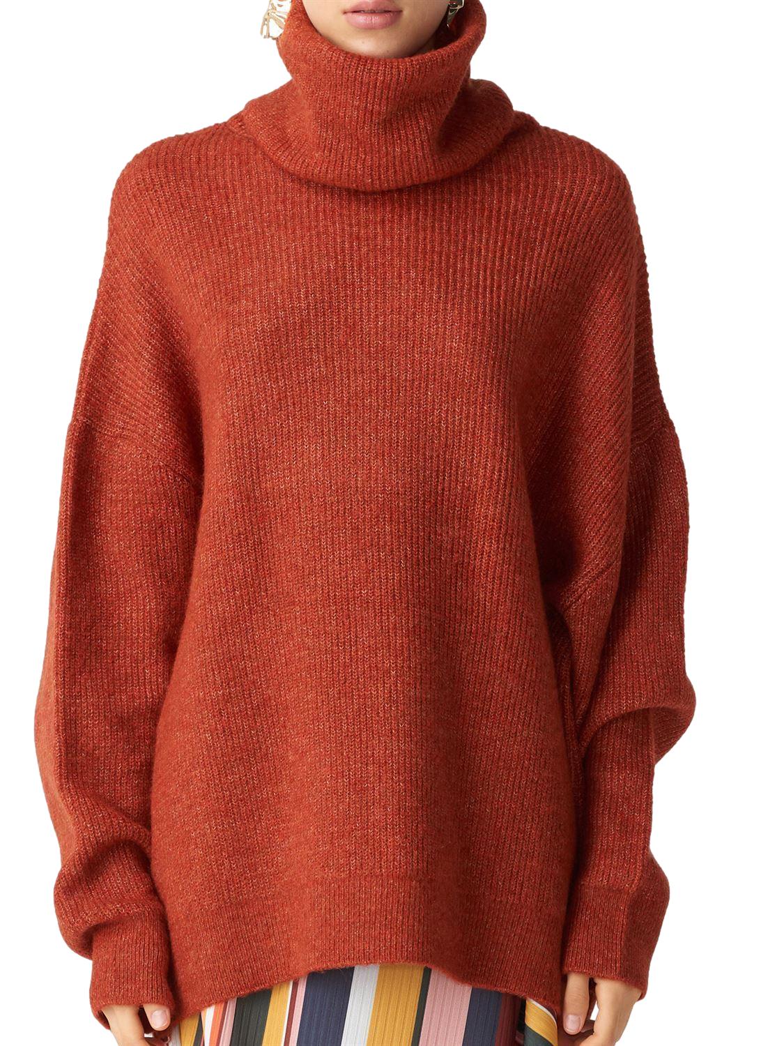 A cozy Turtleneck Wide Sweater in a soft acrylic-polyester blend, featuring a relaxed fit and stylish turtleneck design.