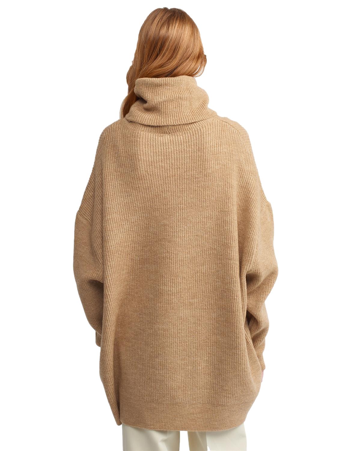 A cozy Turtleneck Wide Sweater in a soft acrylic-polyester blend, featuring a relaxed fit and stylish turtleneck design.