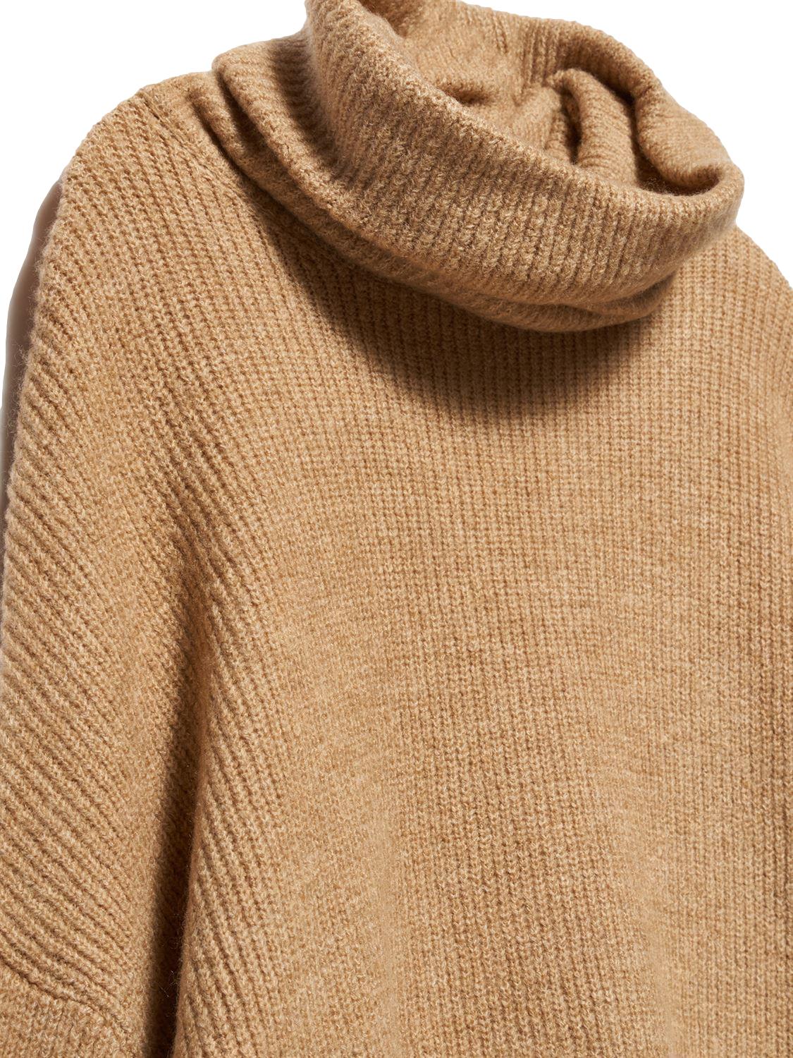 A cozy Turtleneck Wide Sweater in a soft acrylic-polyester blend, featuring a relaxed fit and stylish turtleneck design.