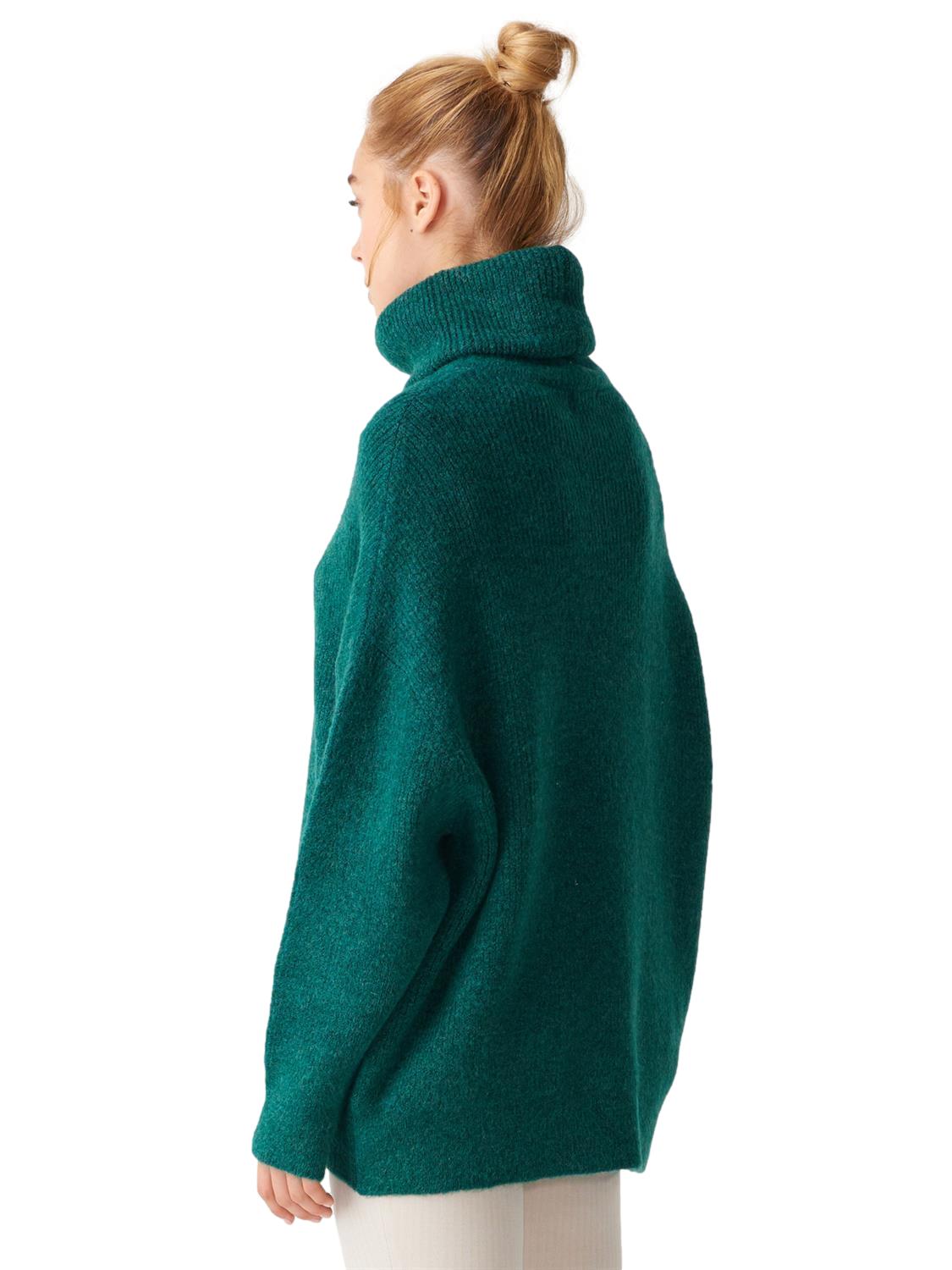 A cozy Turtleneck Wide Sweater in a soft acrylic-polyester blend, featuring a relaxed fit and stylish turtleneck design.