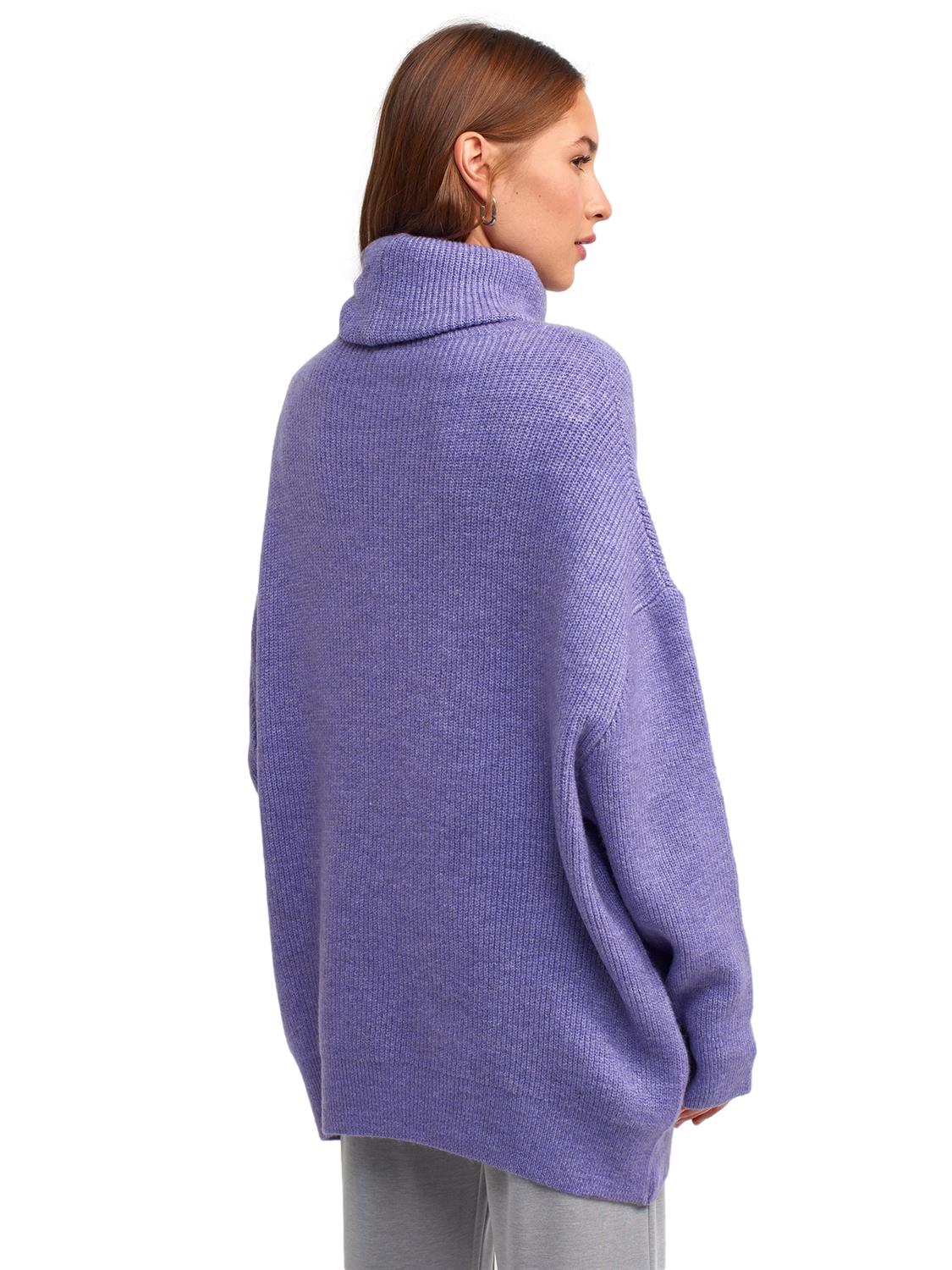 A cozy Turtleneck Wide Sweater in a soft acrylic-polyester blend, featuring a relaxed fit and stylish turtleneck design.