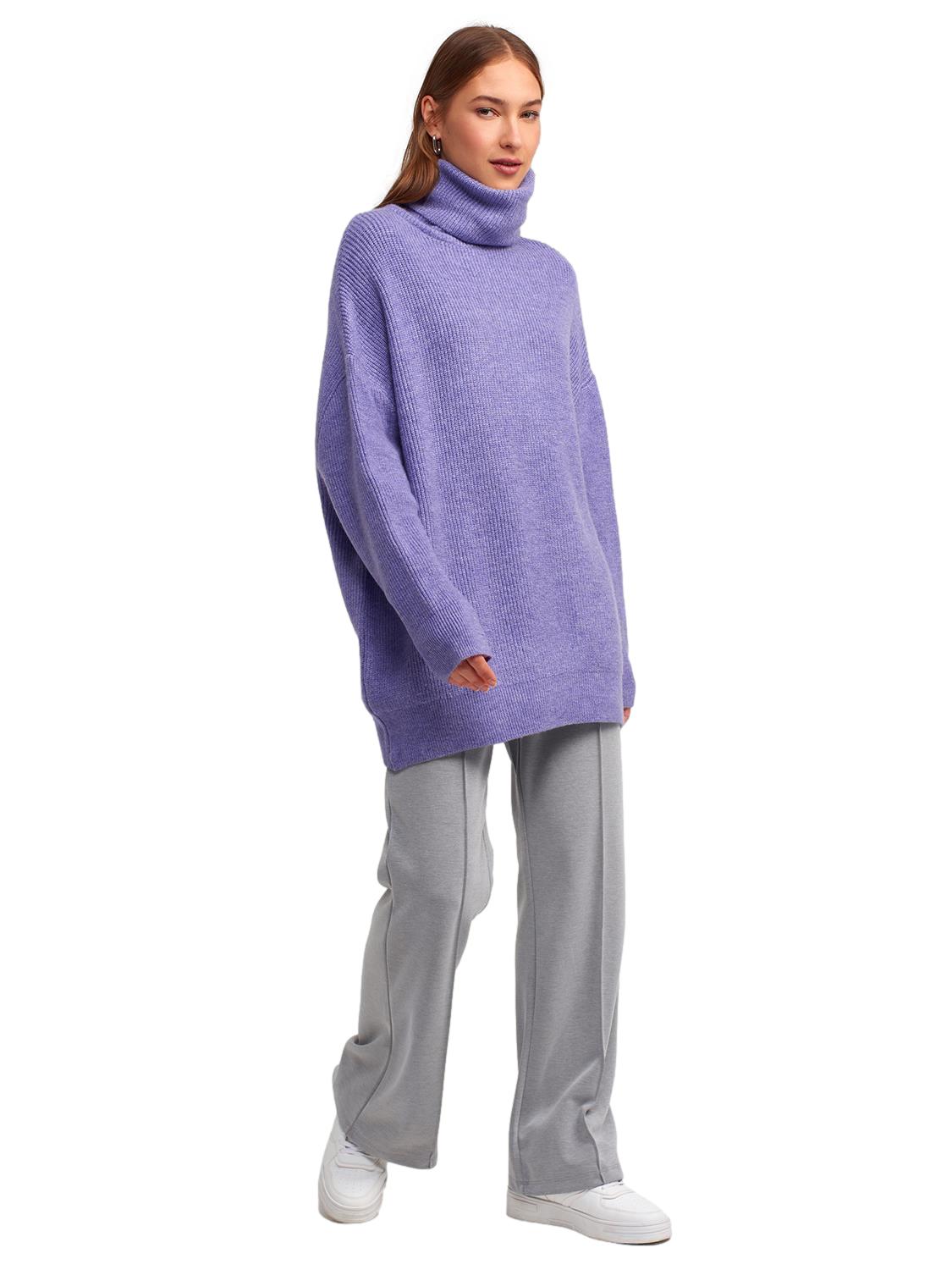 A cozy Turtleneck Wide Sweater in a soft acrylic-polyester blend, featuring a relaxed fit and stylish turtleneck design.