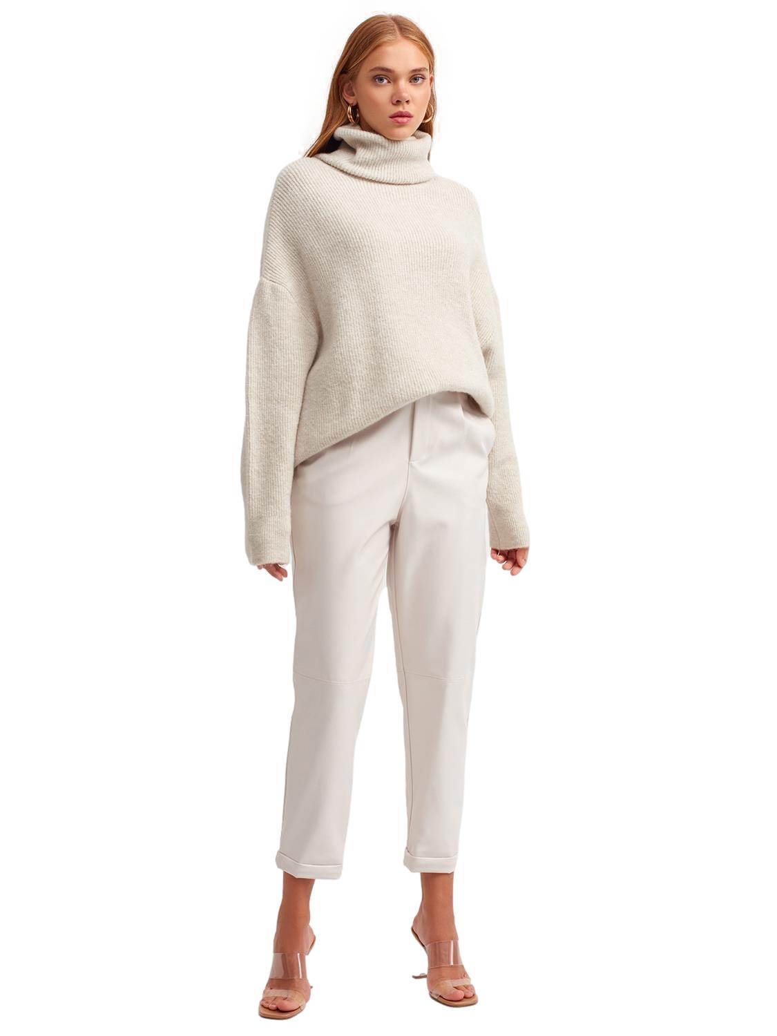 A cozy Turtleneck Wide Sweater in a soft acrylic-polyester blend, featuring a relaxed fit and stylish turtleneck design.