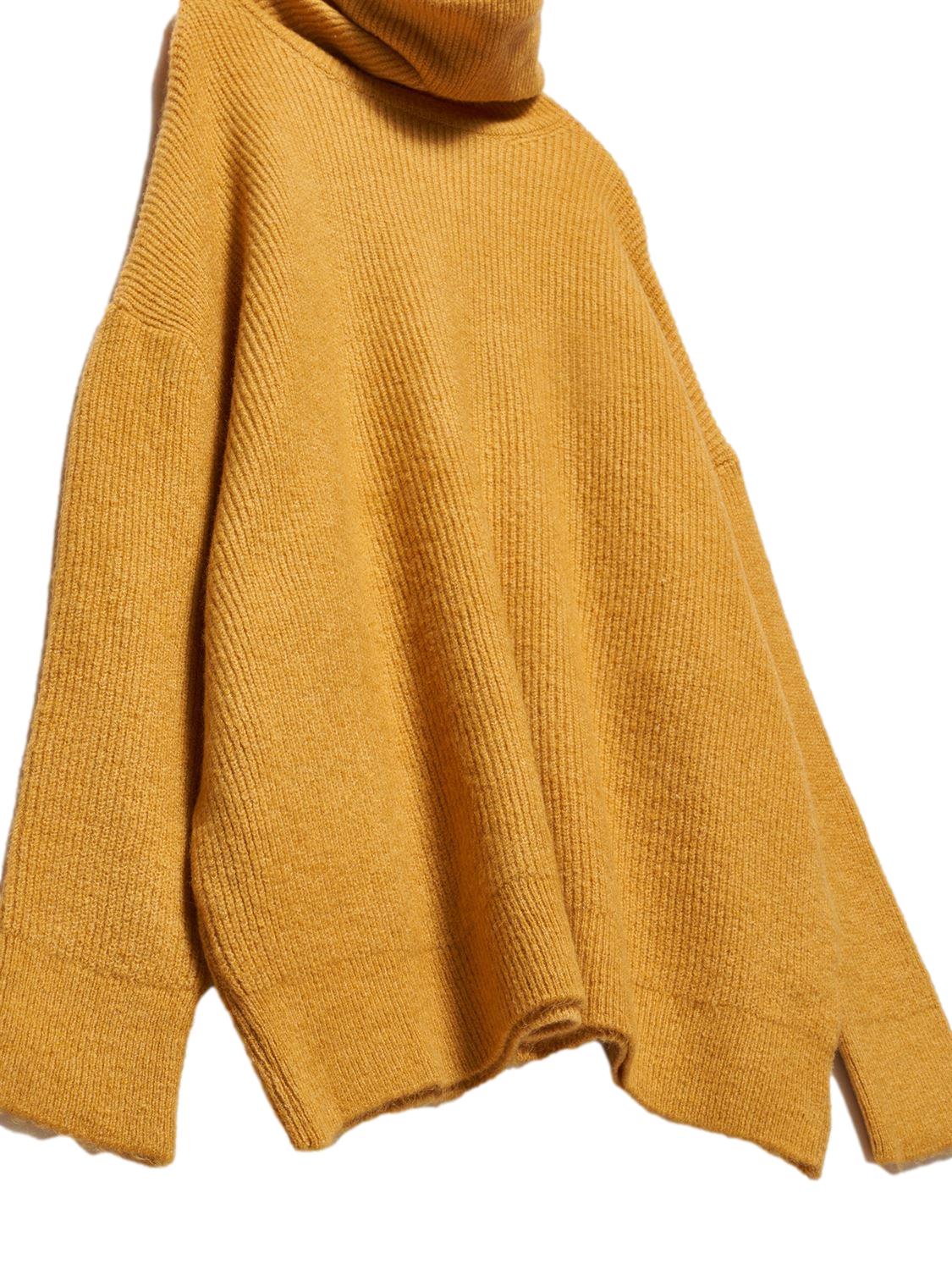 A cozy Turtleneck Wide Sweater in a soft acrylic-polyester blend, featuring a relaxed fit and stylish turtleneck design.