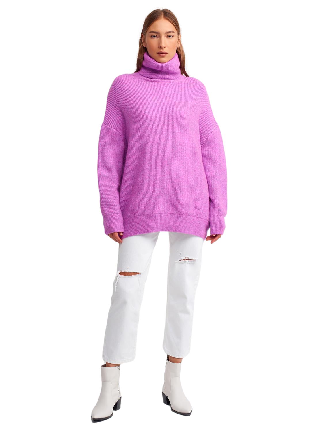 A cozy Turtleneck Wide Sweater in a soft acrylic-polyester blend, featuring a relaxed fit and stylish turtleneck design.