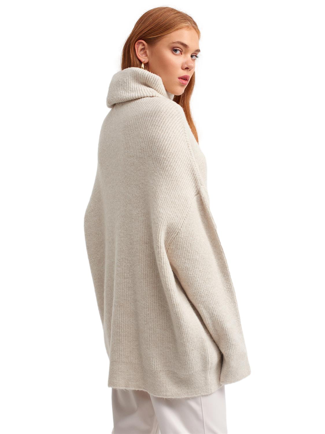 A cozy Turtleneck Wide Sweater in a soft acrylic-polyester blend, featuring a relaxed fit and stylish turtleneck design.