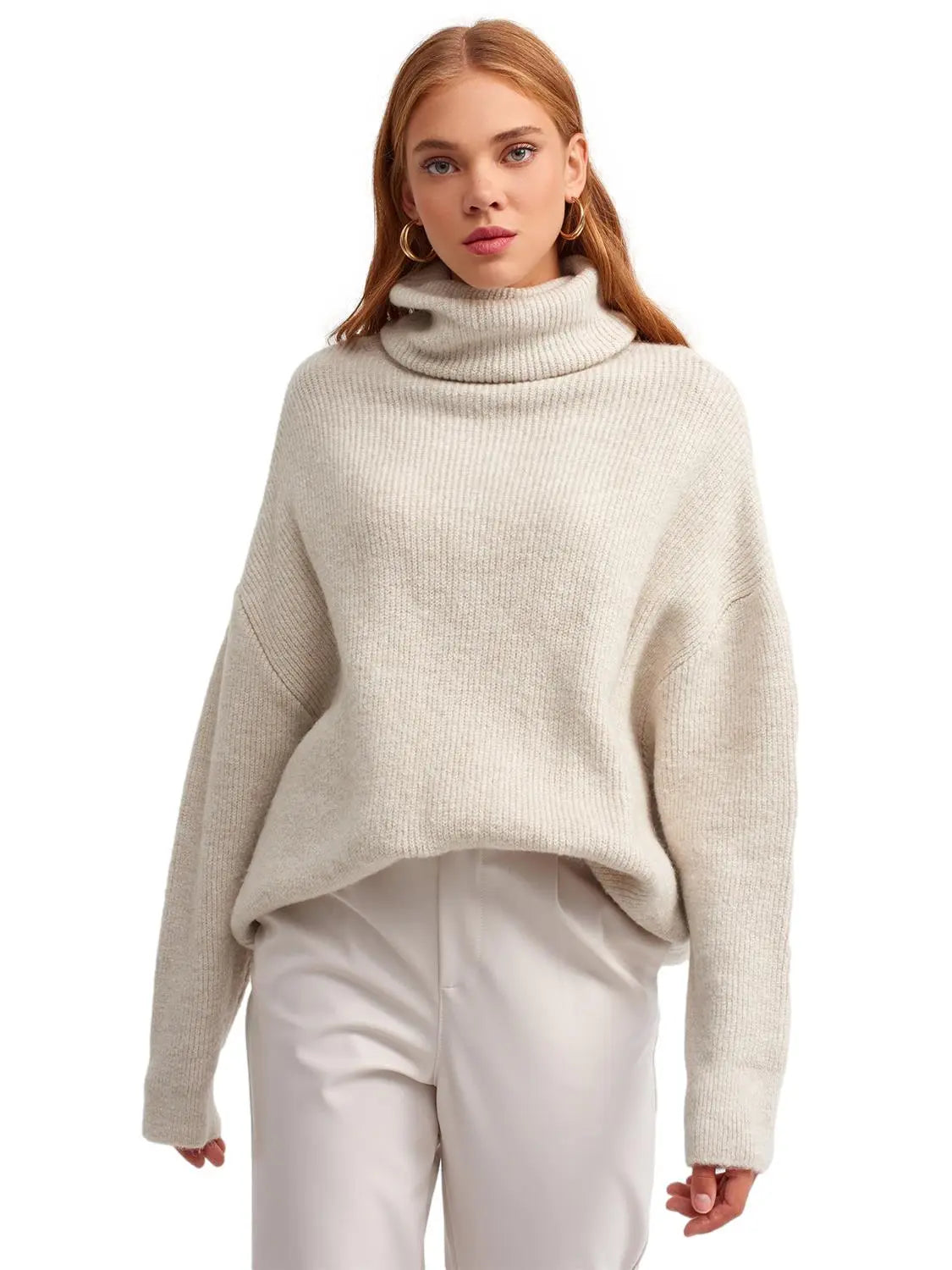 A cozy Turtleneck Wide Sweater in a soft acrylic-polyester blend, featuring a relaxed fit and stylish turtleneck design.