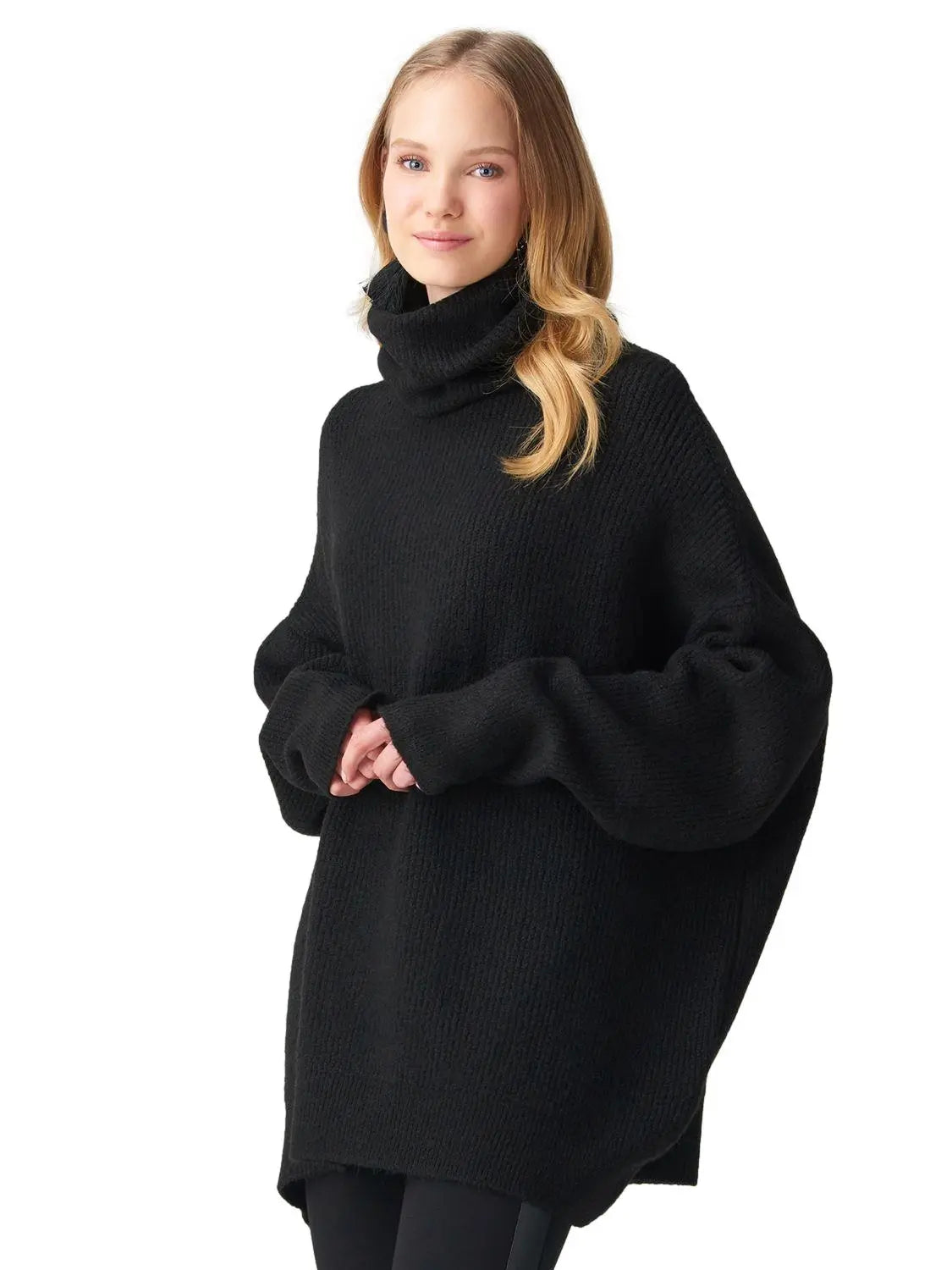 A cozy Turtleneck Wide Sweater in a soft acrylic-polyester blend, featuring a relaxed fit and stylish turtleneck design.