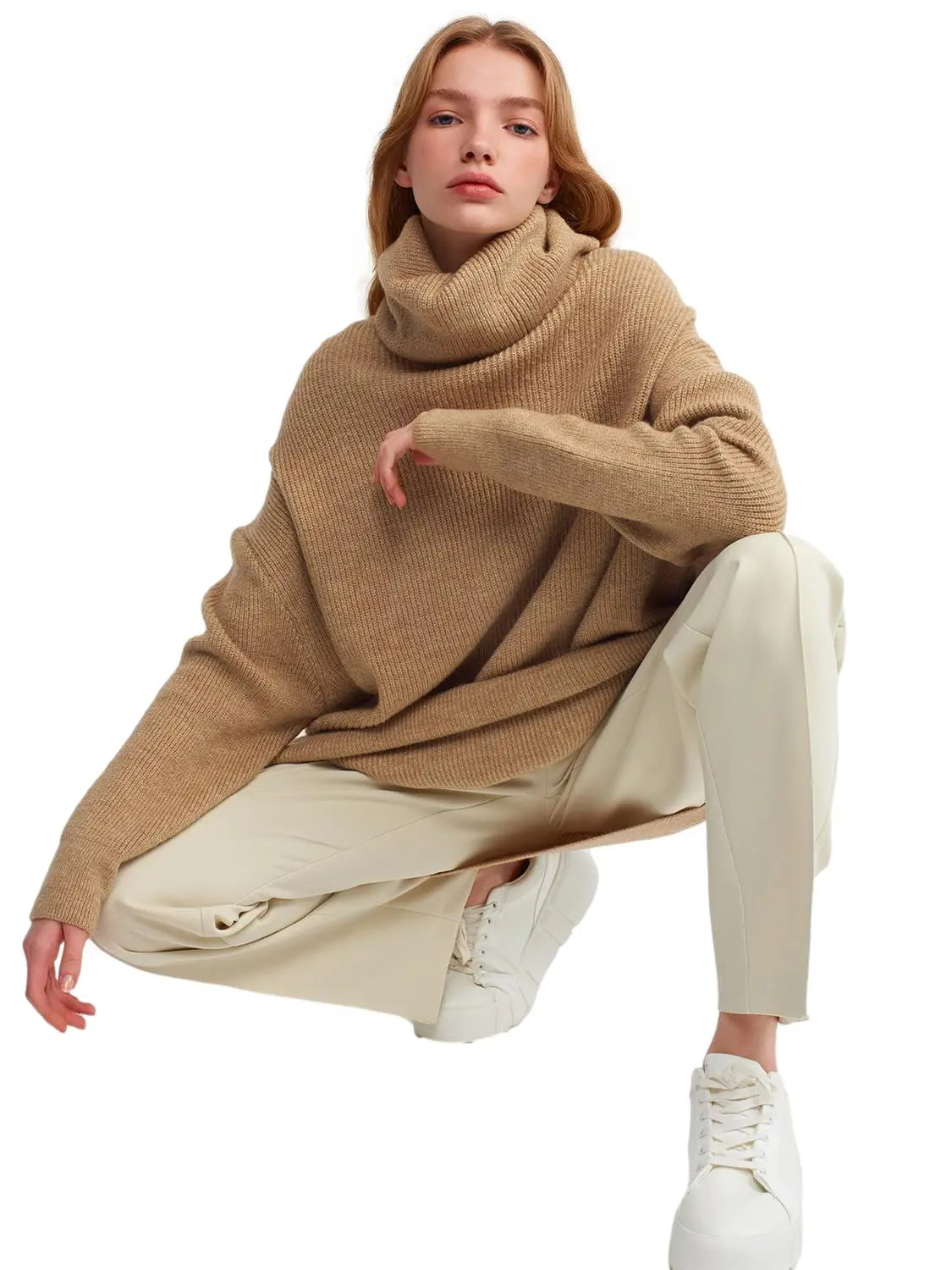 A cozy Turtleneck Wide Sweater in a soft acrylic-polyester blend, featuring a relaxed fit and stylish turtleneck design.