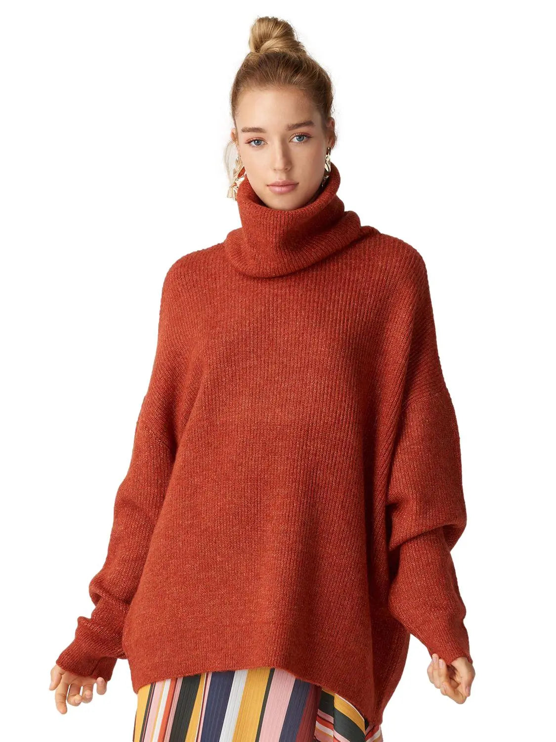 A cozy Turtleneck Wide Sweater in a soft acrylic-polyester blend, featuring a relaxed fit and stylish turtleneck design.