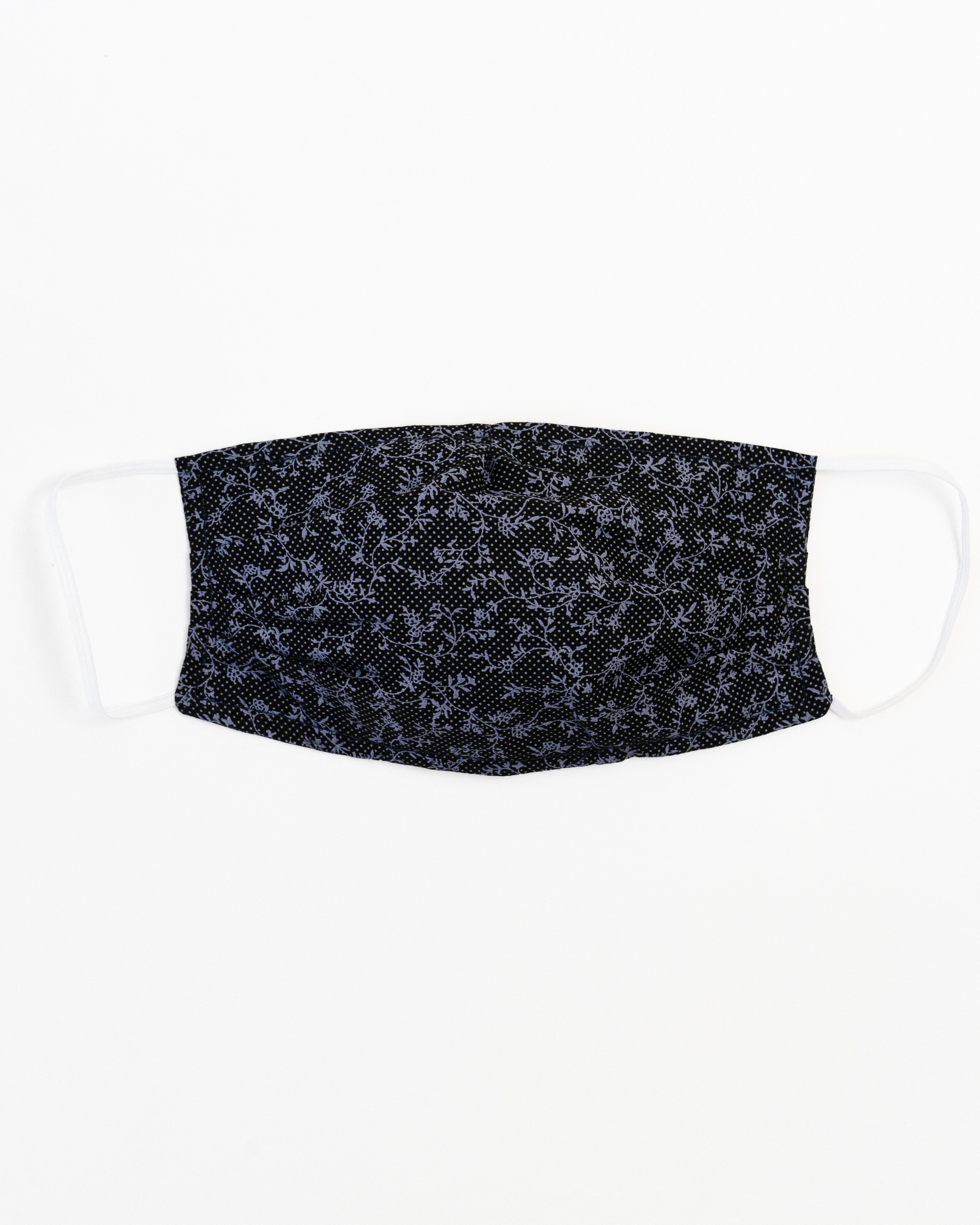 Tuscany Face Mask made of 100% cotton, featuring a stylish print, pleats for comfort, and a pocket for filter insertion.