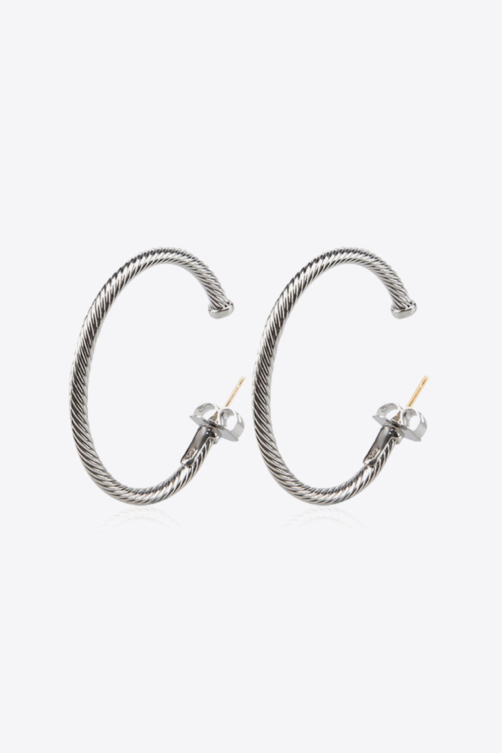 Twisted Copper C-Hoop Earrings displayed in a flat lay style, showcasing their modern minimalist design and 18k platinum-plated finish.