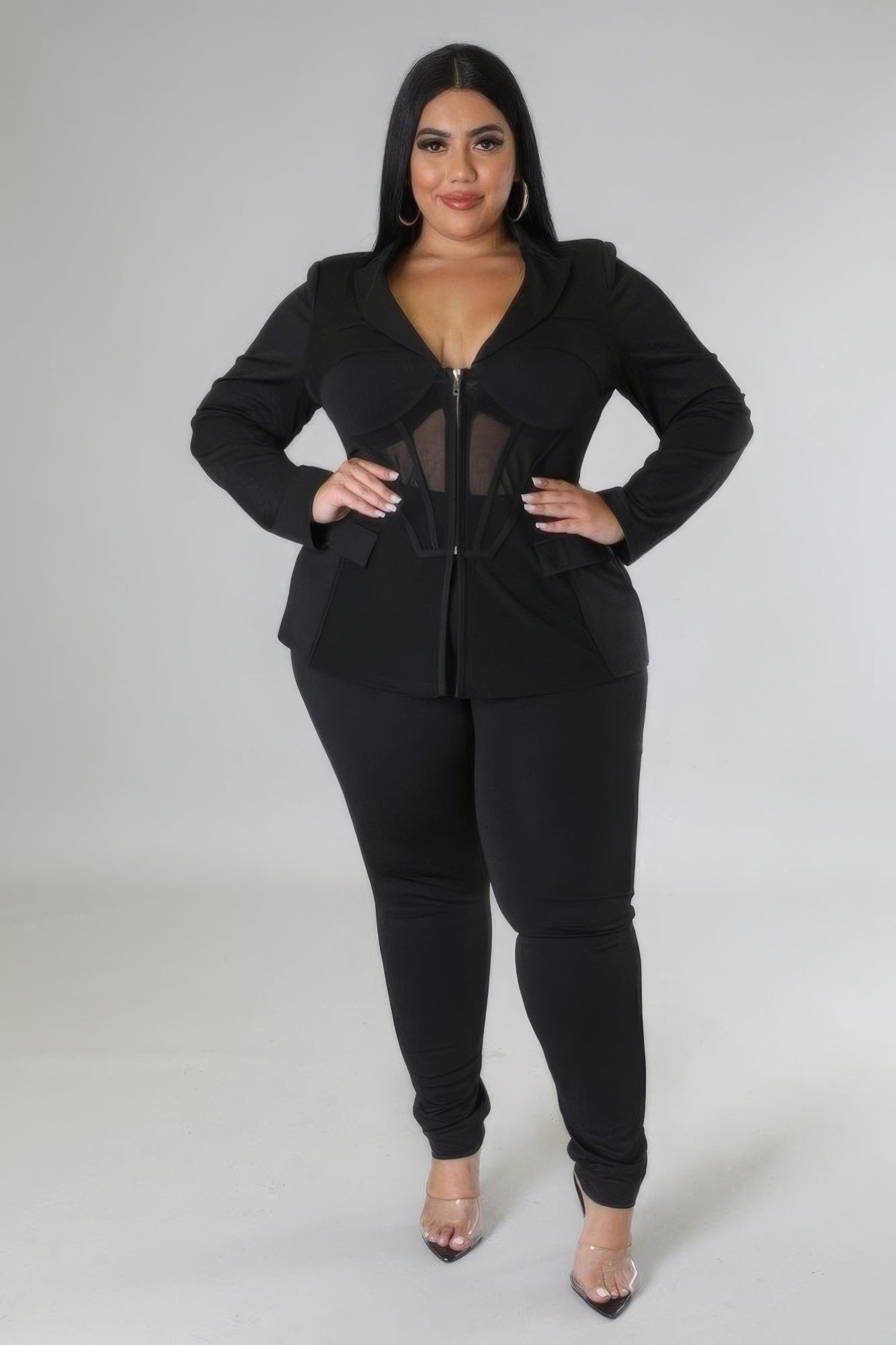 Elegant Two-Piece Set in Black featuring a stretchy top with collar and high-waisted pants with zipper closure, designed for comfort and style.