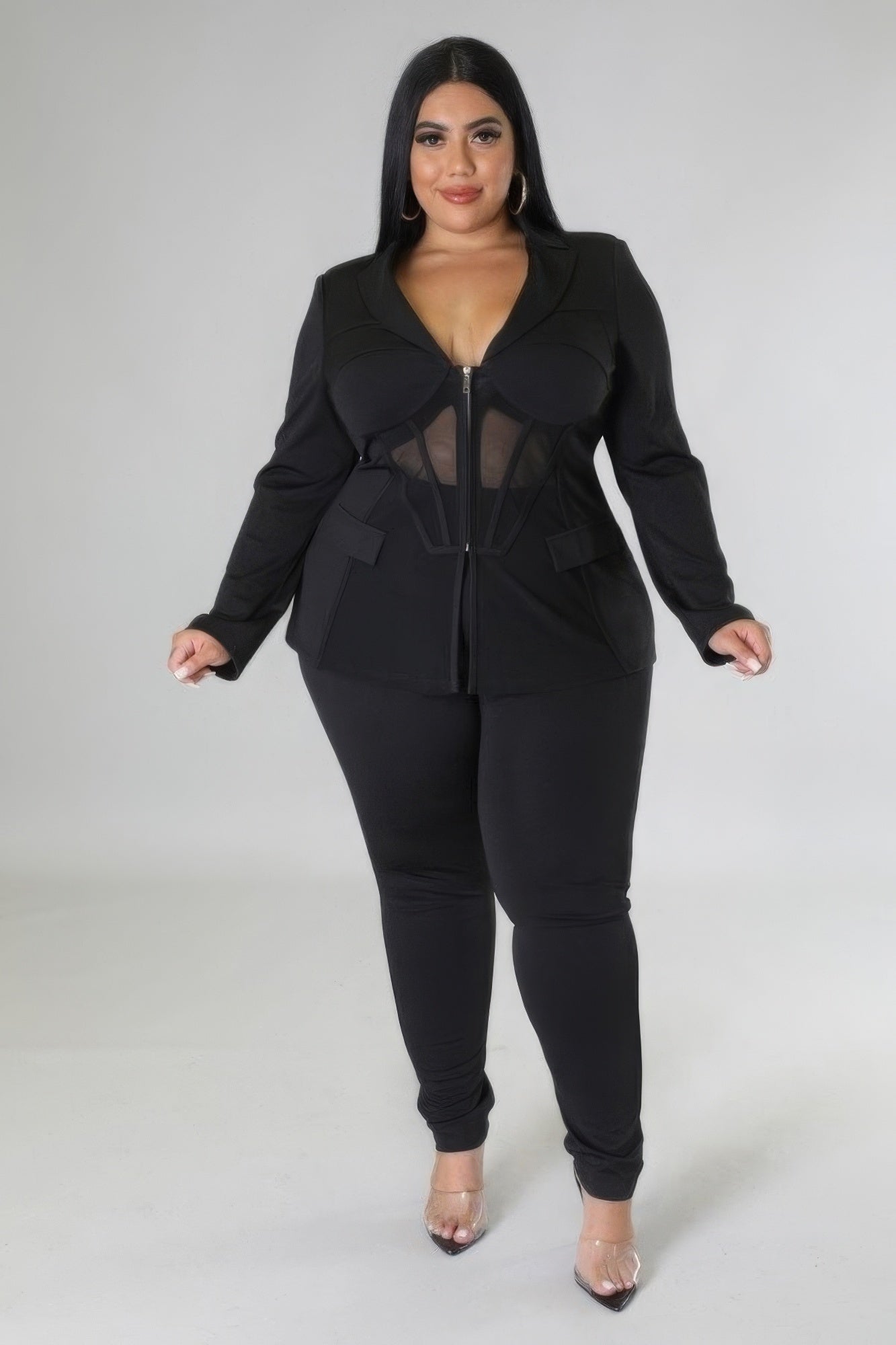 Elegant Two-Piece Set in Black featuring a stretchy top with collar and high-waisted pants with zipper closure, designed for comfort and style.