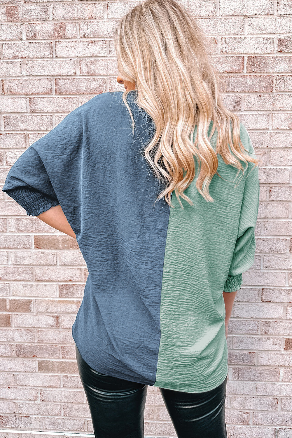 Two-Tone Textured V-Neck Blouse featuring a chic design with smocked details and three-quarter dolman sleeves, perfect for casual wear.