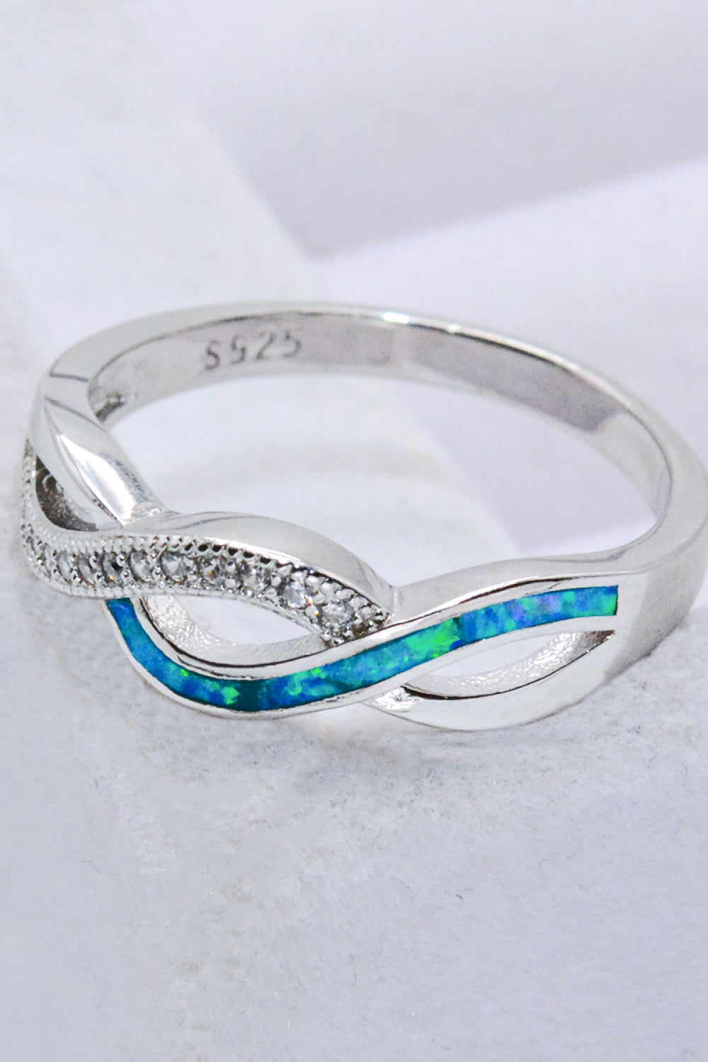 Two-Tone Twisted Opal Ring featuring a minimalist design with 925 sterling silver and Australian opal, elegantly polished.