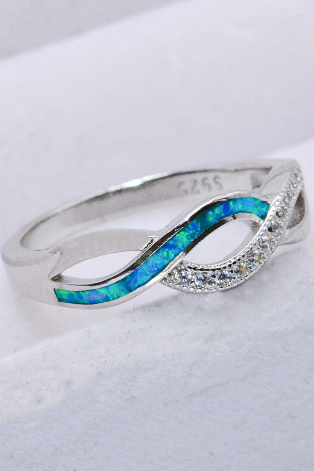 Two-Tone Twisted Opal Ring featuring a minimalist design with 925 sterling silver and Australian opal, elegantly polished.