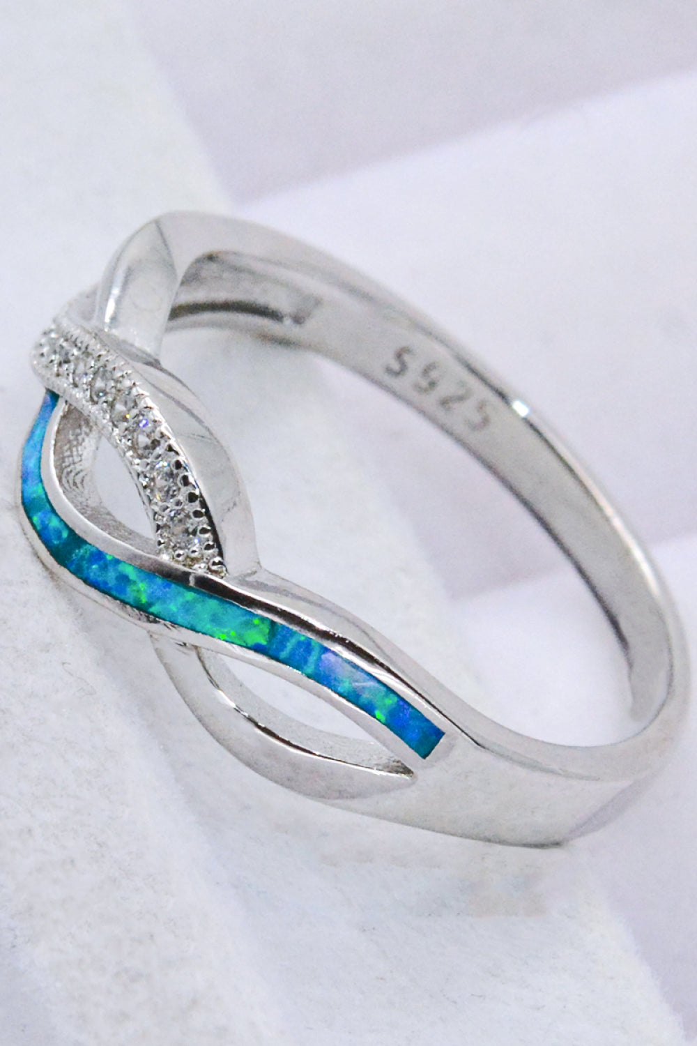 Two-Tone Twisted Opal Ring featuring a minimalist design with 925 sterling silver and Australian opal, elegantly polished.