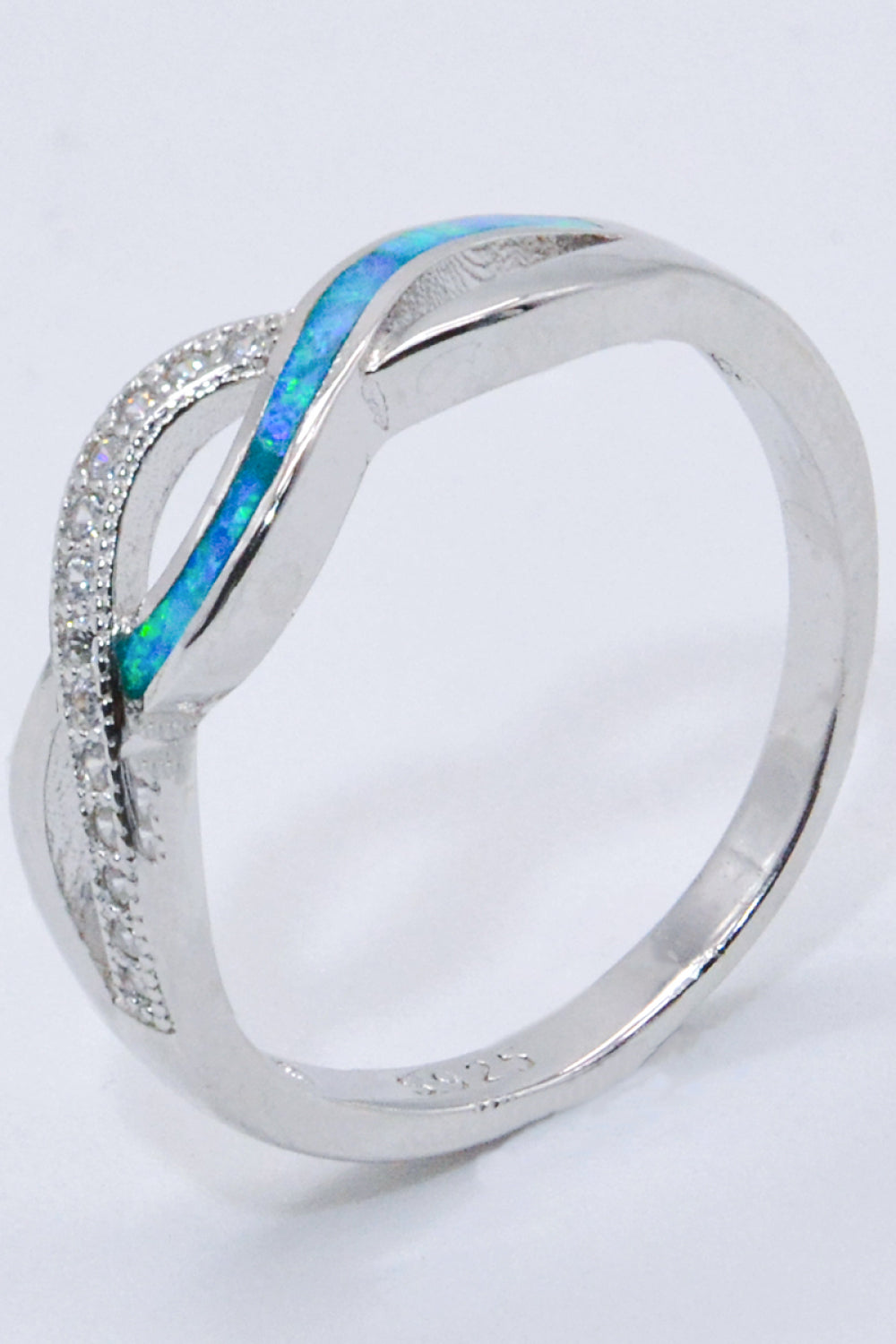 Two-Tone Twisted Opal Ring featuring a minimalist design with 925 sterling silver and Australian opal, elegantly polished.