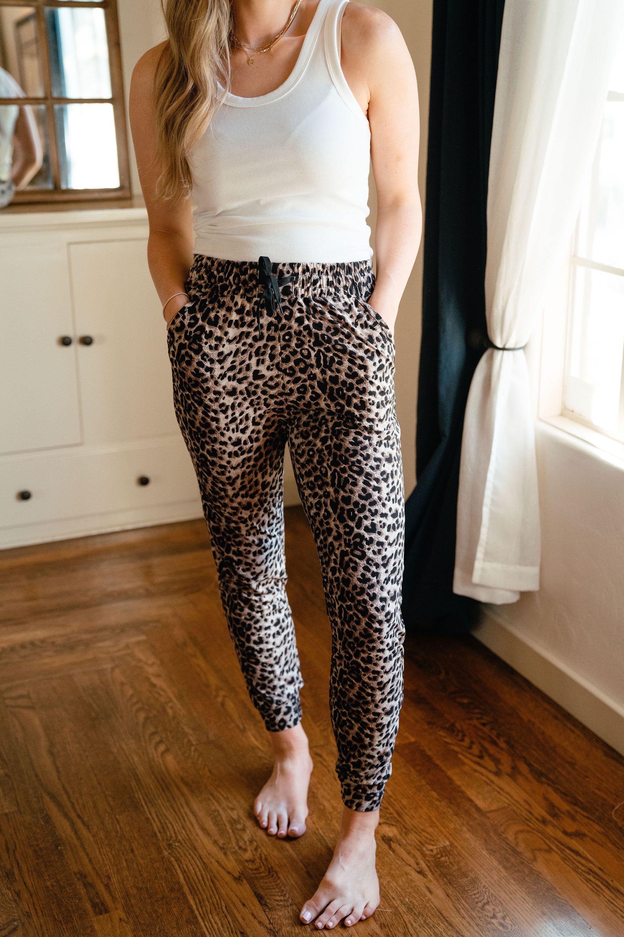 A pair of ultra soft joggers in a stylish leopard print, showcasing their comfortable fit and trendy design.