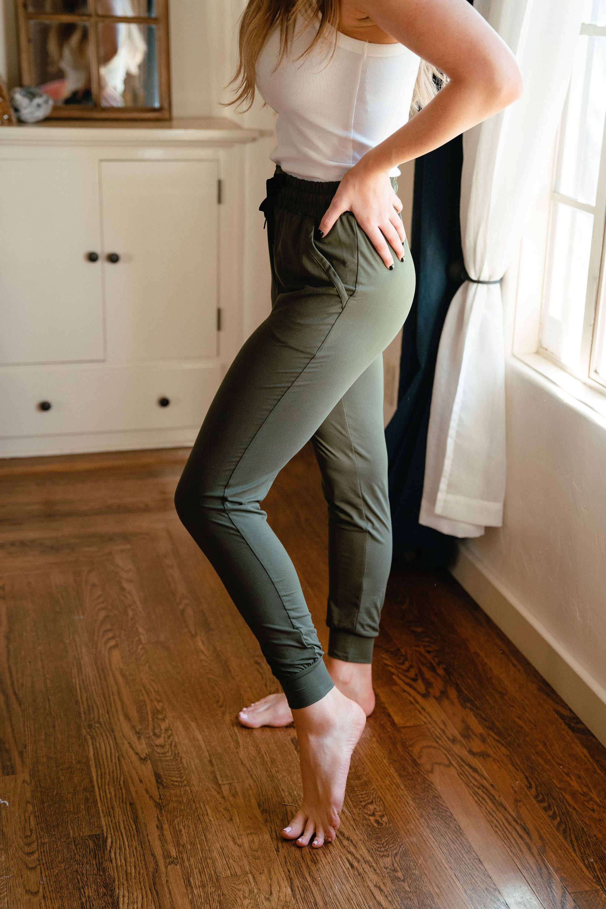 A pair of olive green ultra soft joggers, showcasing a comfortable fit with a stylish design, perfect for lounging or casual outings.