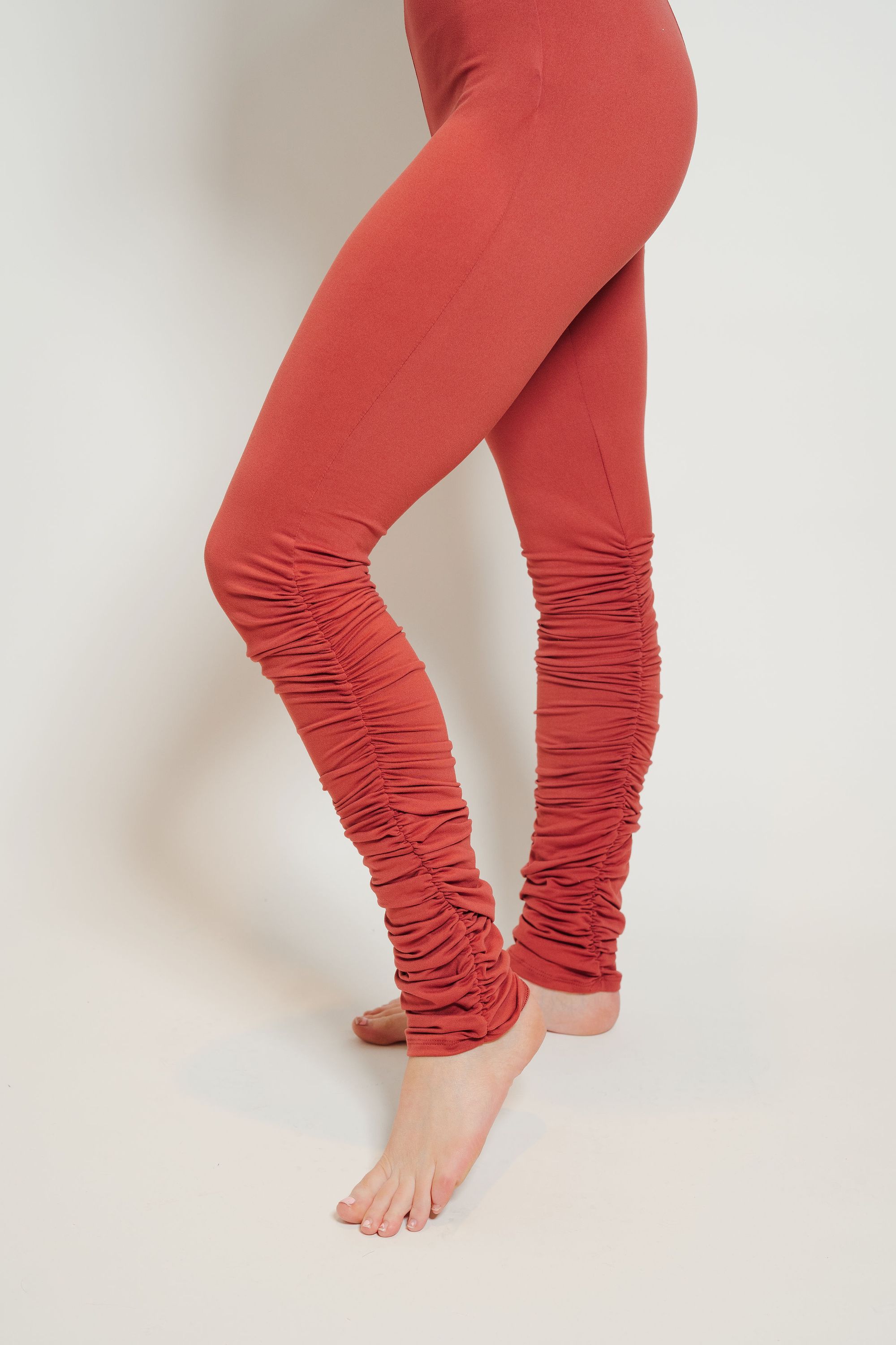 Ultra Soft Stacked Leggings in Brick color with ruffled bottoms, showcasing a comfortable fit and stylish design.