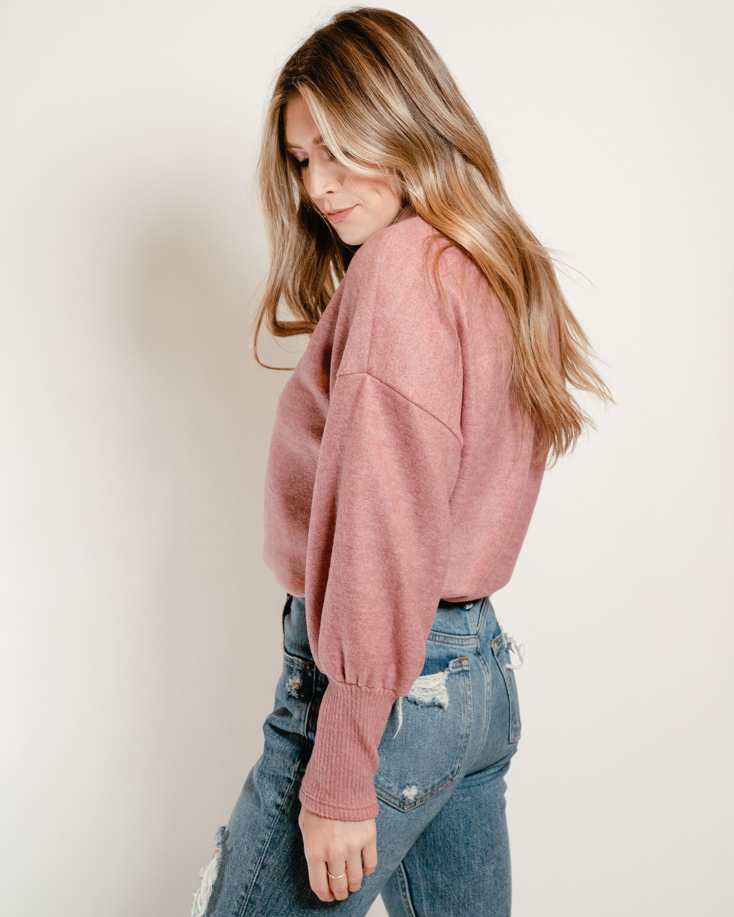 A cozy Ultra Soft Sweater in Deep Rose with billowing sleeves and ribbed cuffs, perfect for spring layering.