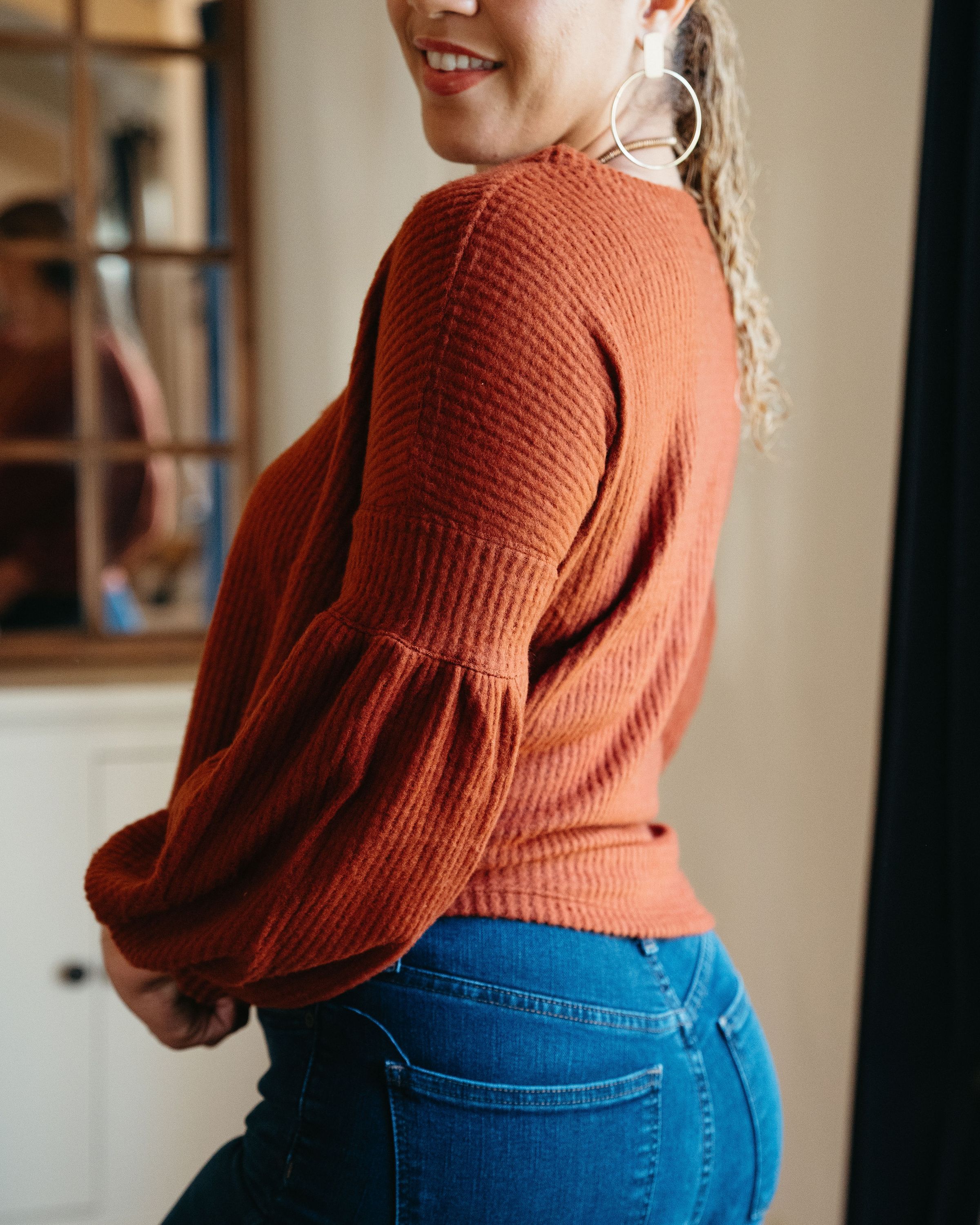 Urban Cozy Blouse in Brown featuring textured fabric and stylish cuffs, perfect for casual and dressy occasions.