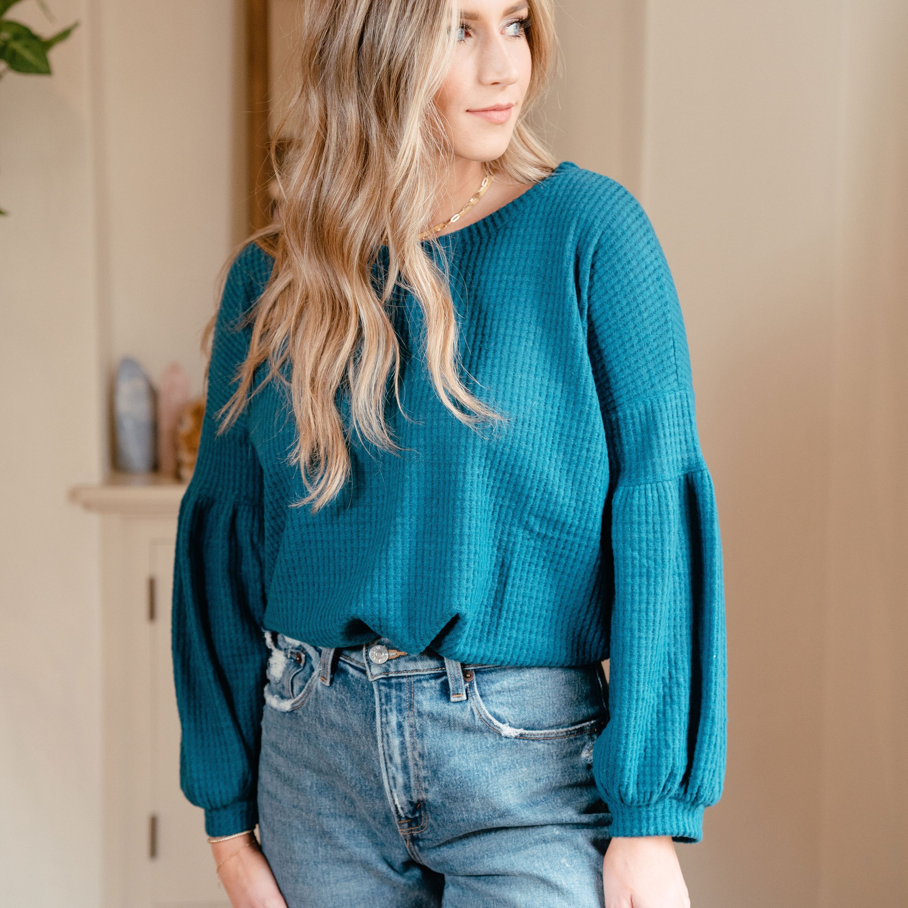 Urban Cozy Blouse in Teal featuring textured fabric and cuffed sleeves, perfect for casual styling.