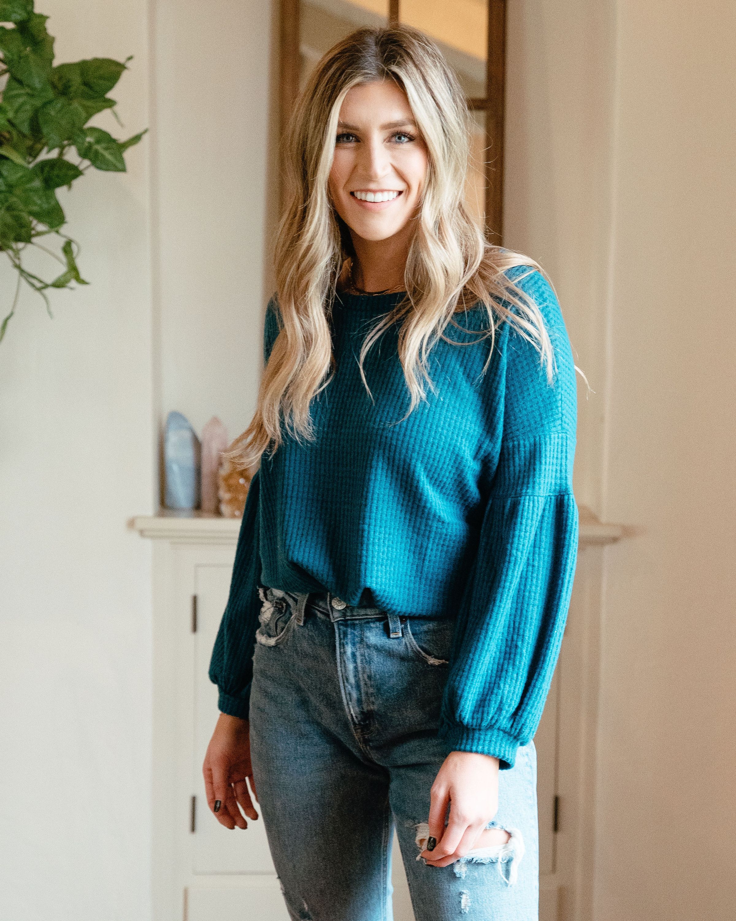 Urban Cozy Blouse in Teal featuring textured fabric and cuffed sleeves, perfect for casual styling.