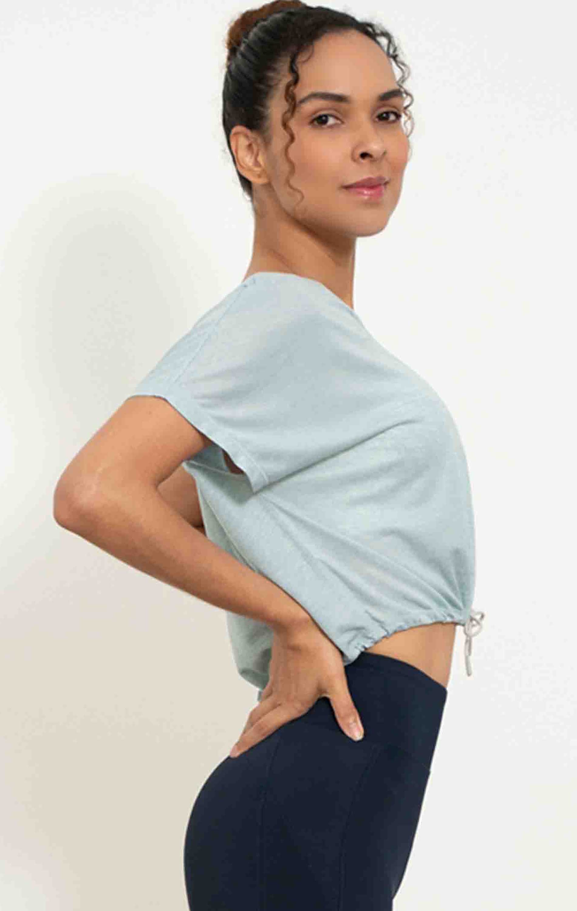 Urban Crop Top featuring adjustable tie strings and V neck design, made from quick-dry polyester fabric.