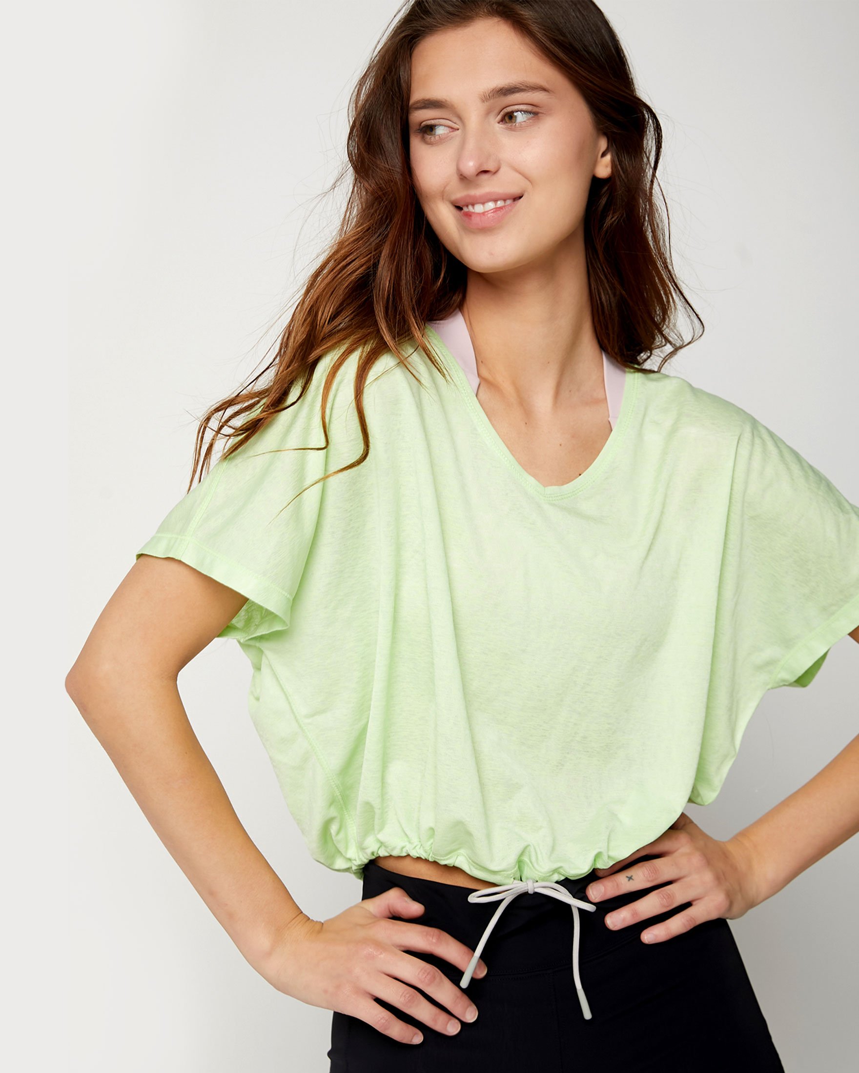 Urban Crop Top featuring adjustable tie strings and V neck design, made from quick-dry polyester fabric.