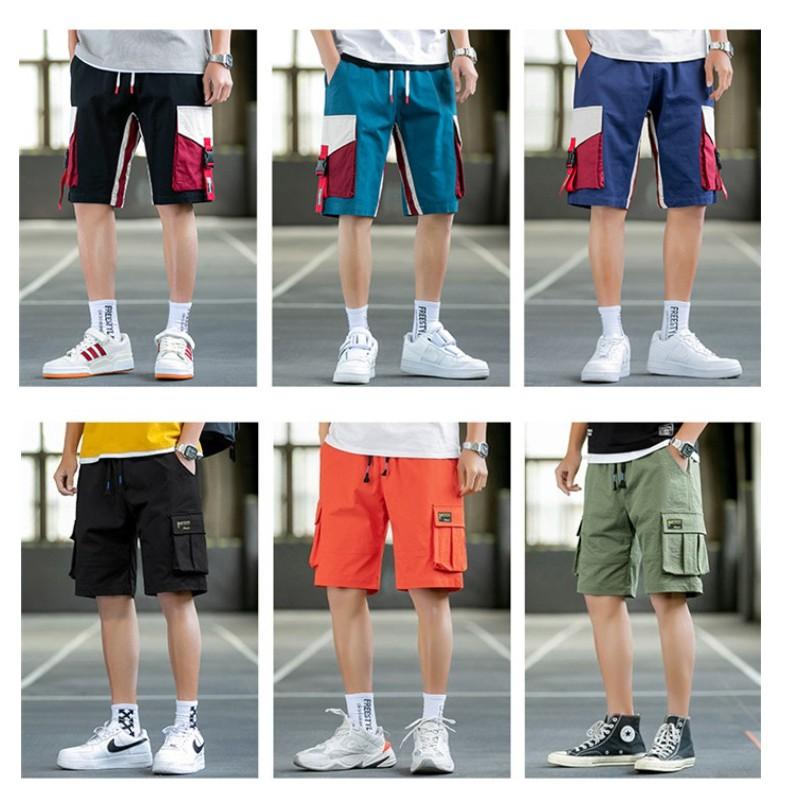 US Stock Men's Tooling Shorts in casual outdoor setting, showcasing drawstring closure and lightweight polyester material.