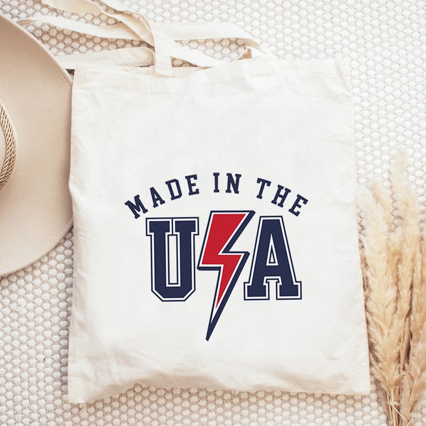 USA Lightning Bolt Tote in vibrant red, white, and blue canvas with a lightning bolt design, perfect for summer outings.