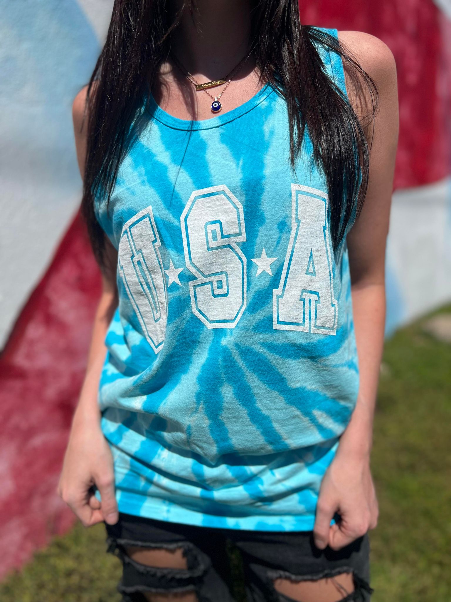 USA Tie Dye Tank top featuring vibrant colors and a unisex design, perfect for casual wear.