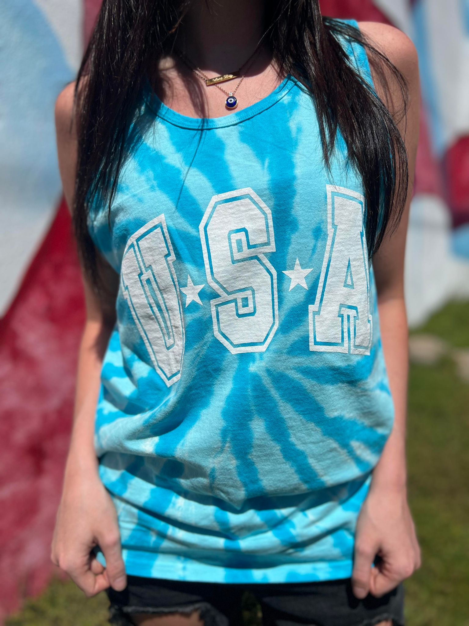 USA Tie Dye Tank top featuring vibrant colors and a unisex design, perfect for casual wear.