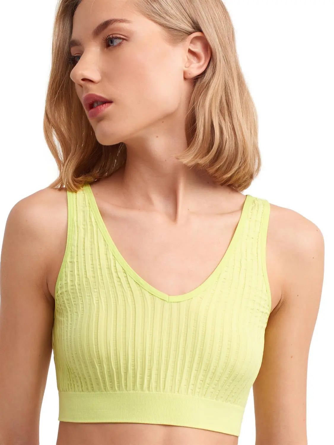 A stylish V Neck Crinkle Top made of soft fabric, featuring a flattering design and adjustable straps, perfect for various occasions.