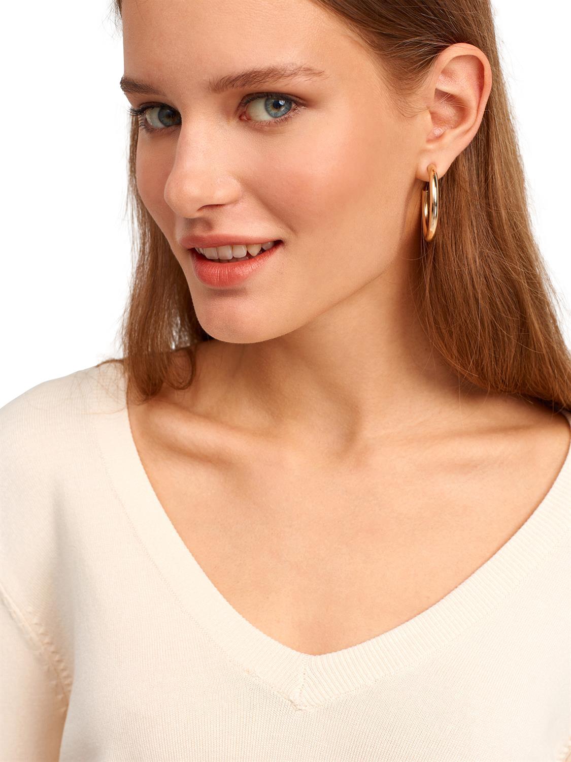 A stylish V Neck Cuff Dropped Sweater in soft fabric, showcasing a modern dropped cuff design and elegant V neckline.