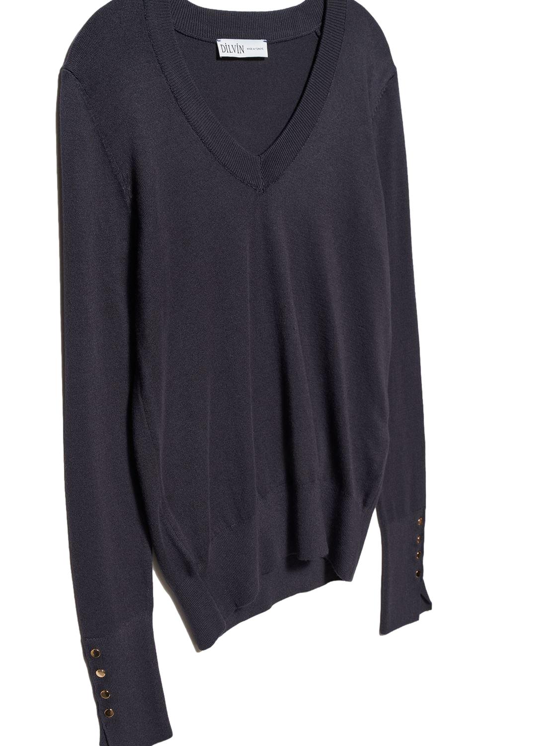 A stylish V Neck Cuff Dropped Sweater in soft fabric, showcasing a modern dropped cuff design and elegant V neckline.