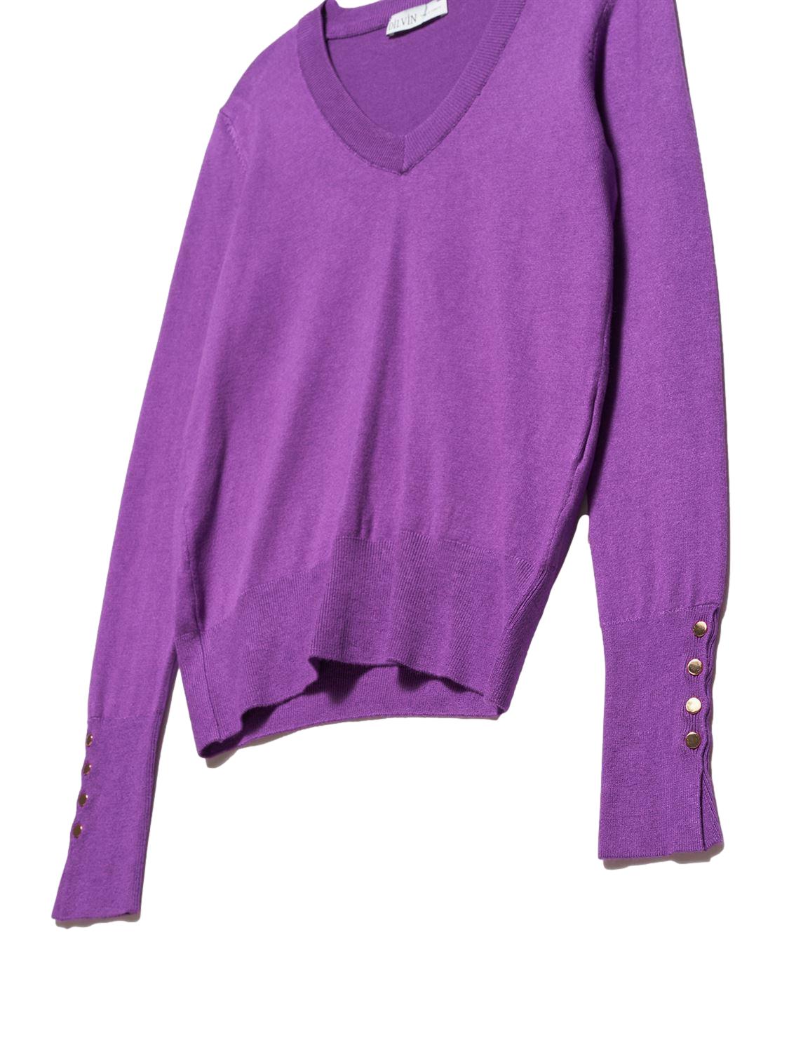 A stylish V Neck Cuff Dropped Sweater in soft fabric, showcasing a modern dropped cuff design and elegant V neckline.