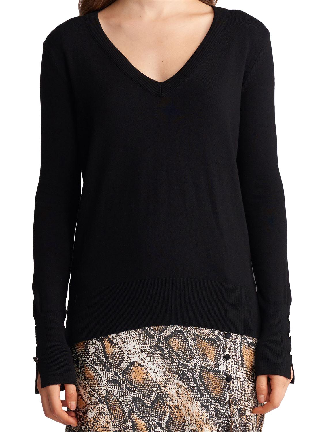 A stylish V Neck Cuff Dropped Sweater in soft fabric, showcasing a modern dropped cuff design and elegant V neckline.