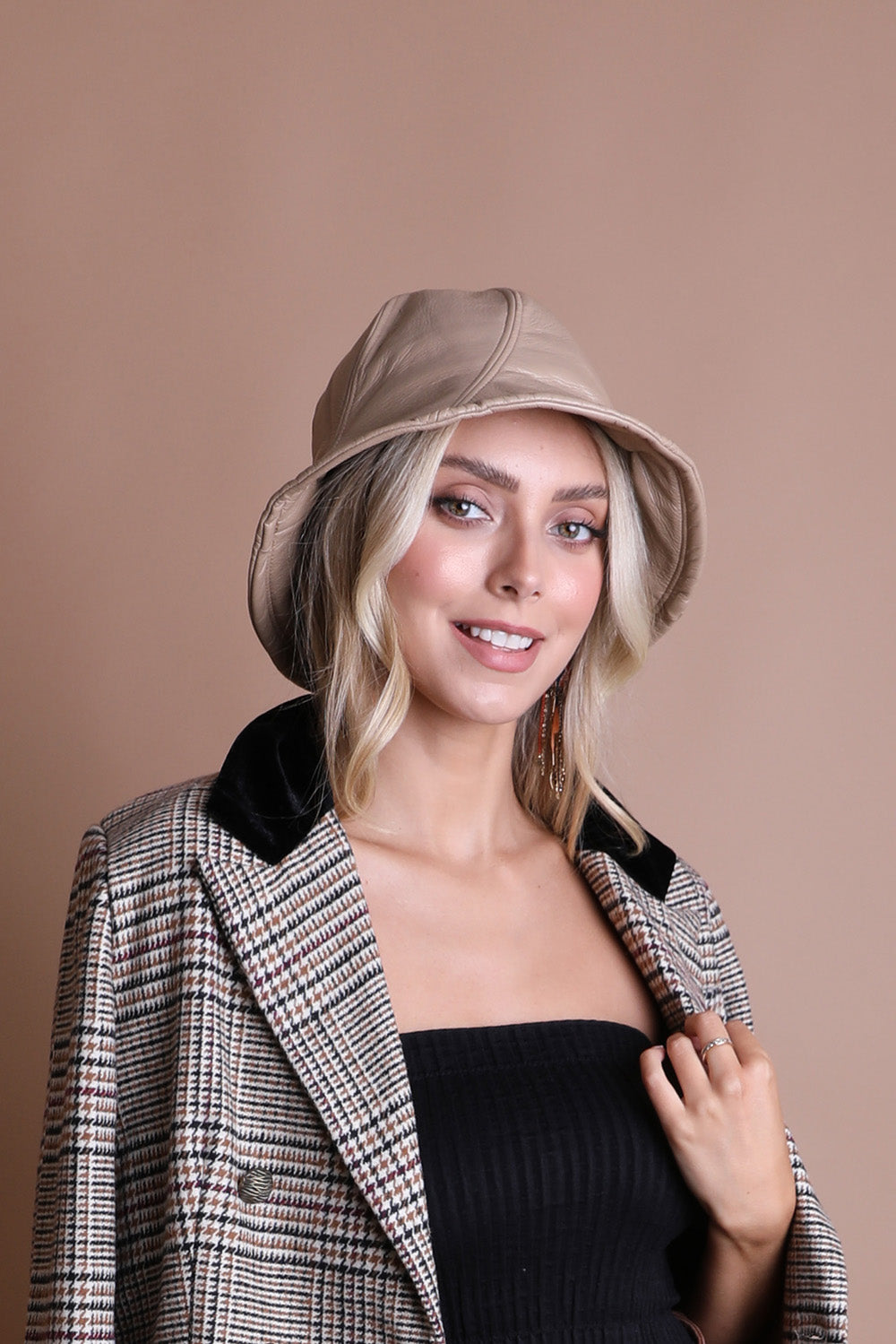 A stylish Vegan Leather Bucket Hat with an adjustable fit, perfect for casual outings and eco-friendly fashion.